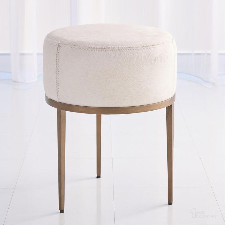 The appearance of Urban Stool With Ivory Hair On Hide In Antique Brass designed by Global Views in the modern / contemporary interior design. This white piece of furniture  was selected by 1StopBedrooms from Urban Collection to add a touch of cosiness and style into your home. Sku: 7.91091. Product Type: Stool. Material: Iron. Image1