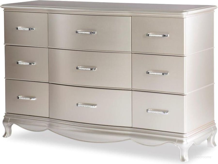 The appearance of Vogue Metallic Glam Dresser designed by Legacy Classic in the transitional interior design. This metallic piece of furniture  was selected by 1StopBedrooms from Vogue Collection to add a touch of cosiness and style into your home. Sku: 0800-1100. Product Type: Dresser. Material: Wood Veneer. Image1