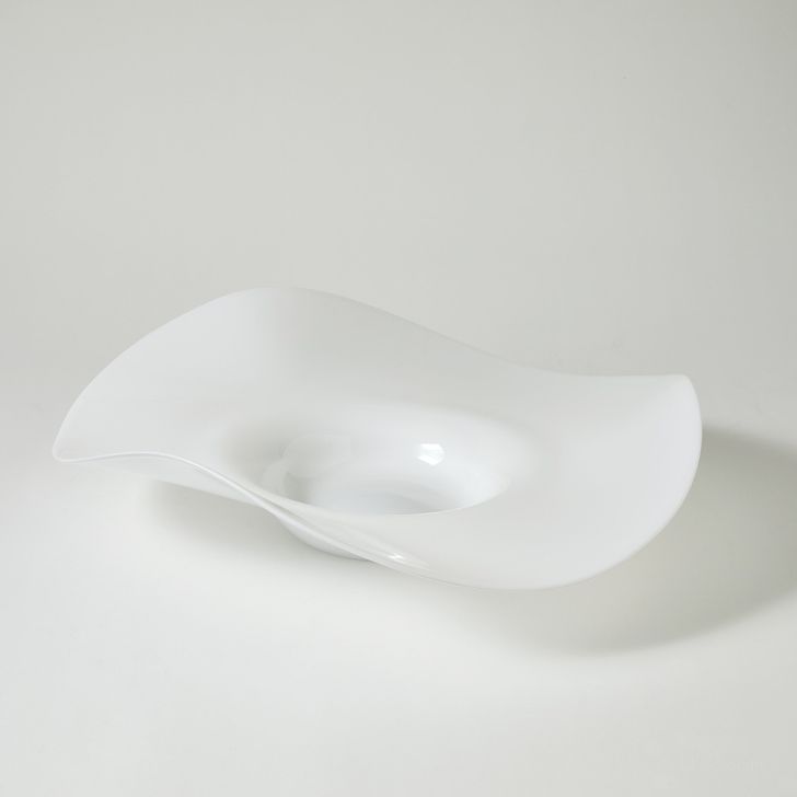 The appearance of Wavy Edge Bowl In White designed by Global Views in the modern / contemporary interior design. This white piece of furniture  was selected by 1StopBedrooms from Wavy Collection to add a touch of cosiness and style into your home. Sku: 6.60607. Material: Glass. Product Type: Bowl. Image1