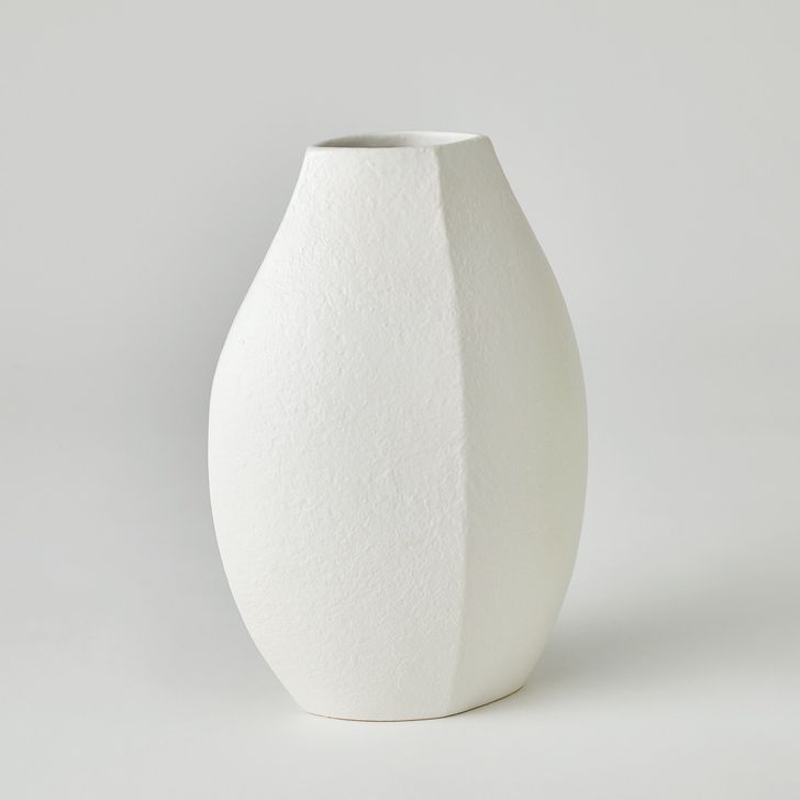 The appearance of Wedge Large Vase In White designed by Global Views in the modern / contemporary interior design. This white piece of furniture  was selected by 1StopBedrooms from Wedge Collection to add a touch of cosiness and style into your home. Sku: 7.10542. Material: Ceramic. Product Type: Vase. Image1