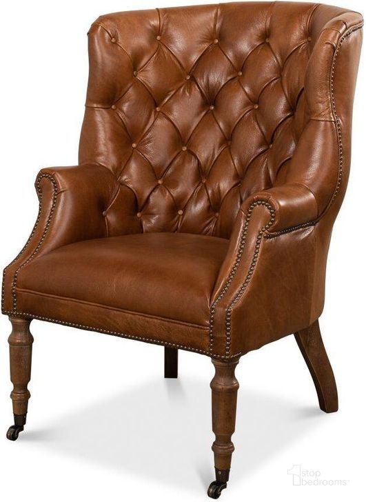 The appearance of Welsh Brown Leather Chair designed by Sarreid in the traditional interior design. This brown faux leather piece of furniture  was selected by 1StopBedrooms from Welsh Collection to add a touch of cosiness and style into your home. Sku: 29521. Product Type: Living Room Chair. Image1