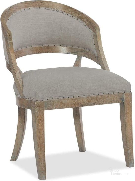 The appearance of Boheme Gray Garnier Barrel Back Side Chair designed by Hooker in the traditional interior design. This grey piece of furniture  was selected by 1StopBedrooms from Boheme Collection to add a touch of cosiness and style into your home. Sku: 5750-75300-MWD. Material: Fabric. Product Type: Dining Chair. Image1