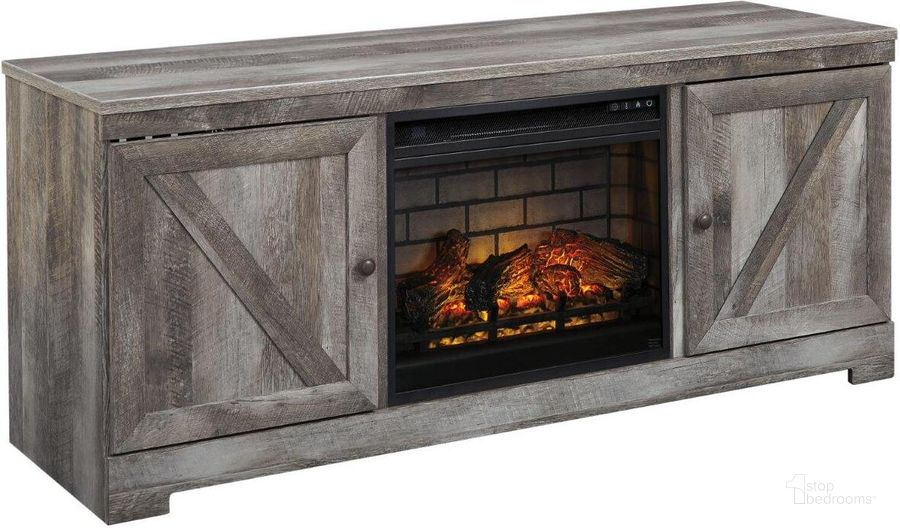The appearance of Wynnlow Rustic Gray 63 Inch TV Stand With Electric Infrared Fireplace designed by Signature Design by Ashley in the rustic / southwestern interior design. This gray piece of furniture  was selected by 1StopBedrooms from Wynnlow Collection to add a touch of cosiness and style into your home. Sku: W440-68;W100-101. Material: Wood. Product Type: TV Stands and TV Console. Image1