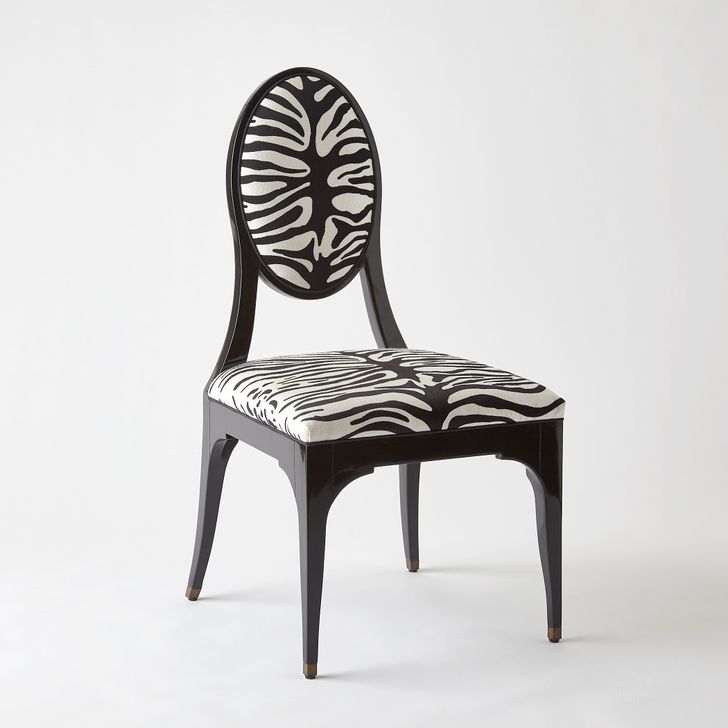 The appearance of Zebra Dining Chair In Black designed by Global Views in the modern / contemporary interior design. This black piece of furniture  was selected by 1StopBedrooms from Zebra Collection to add a touch of cosiness and style into your home. Sku: 2726. Material: Wood. Product Type: Dining Chair. Image1