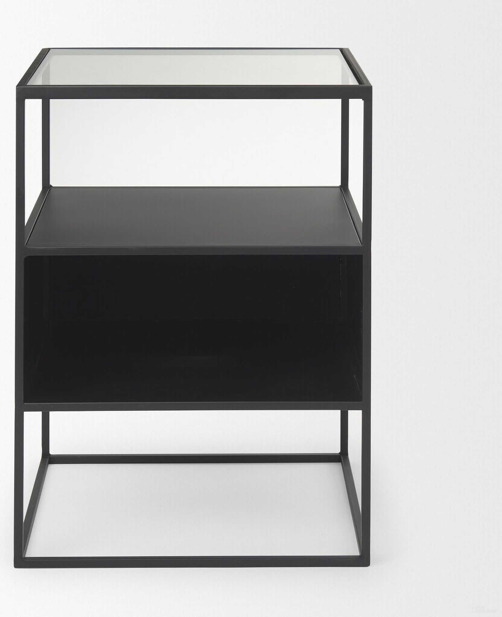 The appearance of 21 Inch Glass and Metal Square Frame End Table with Two Shelves In Clear and Black designed by Homeroots in the modern / contemporary interior design. This clear/black piece of furniture  was selected by 1StopBedrooms from  to add a touch of cosiness and style into your home. Sku: 604465. Material: Glass.