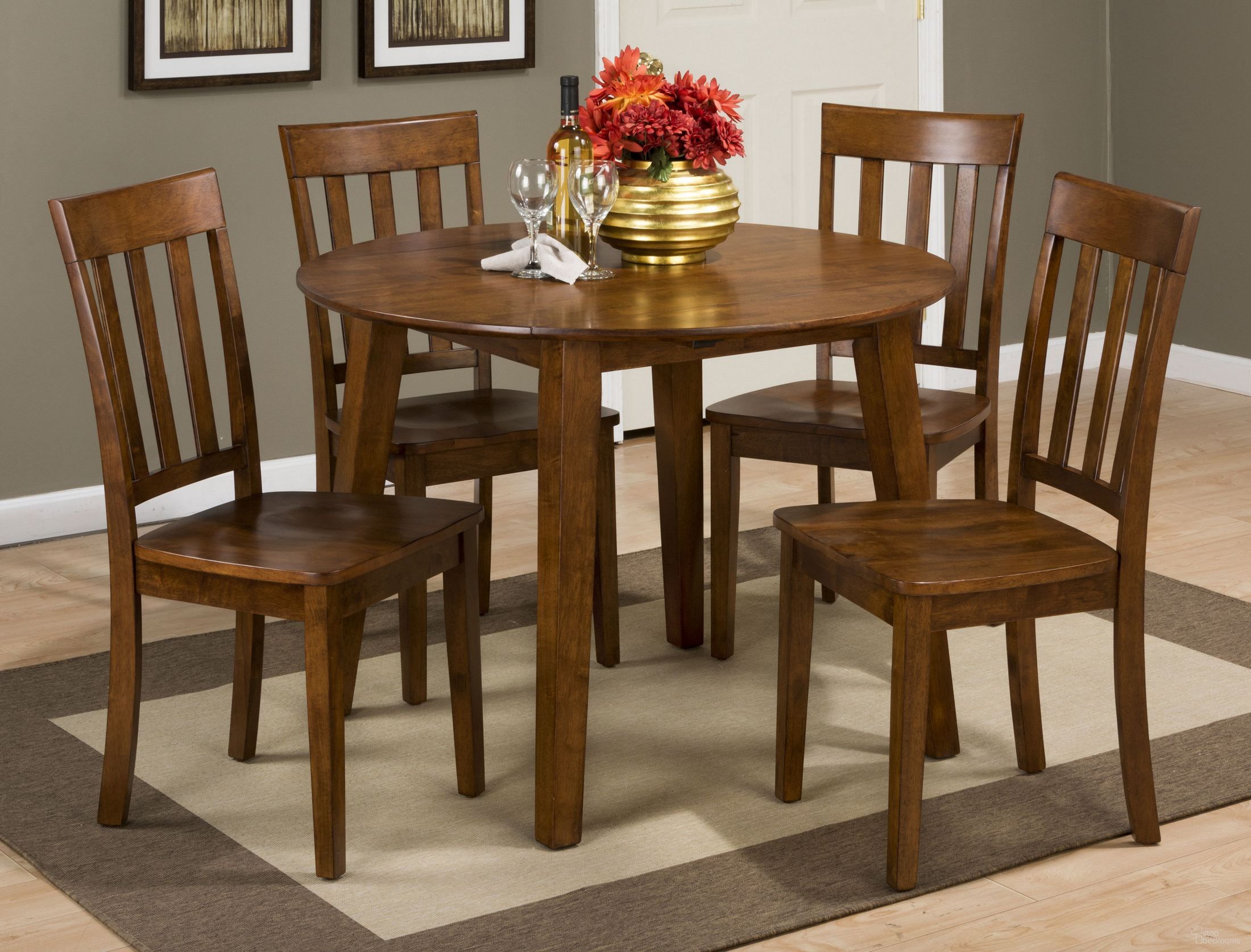 The appearance of Simplicity Caramel Extendable Round Drop-Leaf Dining Room Set designed by Jofran in the transitional interior design. This caramel piece of furniture was selected by 1StopBedrooms from Simplicity Collection to add a touch of cosiness and style into your home. Sku: 452-28;452-319KD. Table Base Style: Legs. Table Top Shape: Round. Material: Wood. Size: 42".