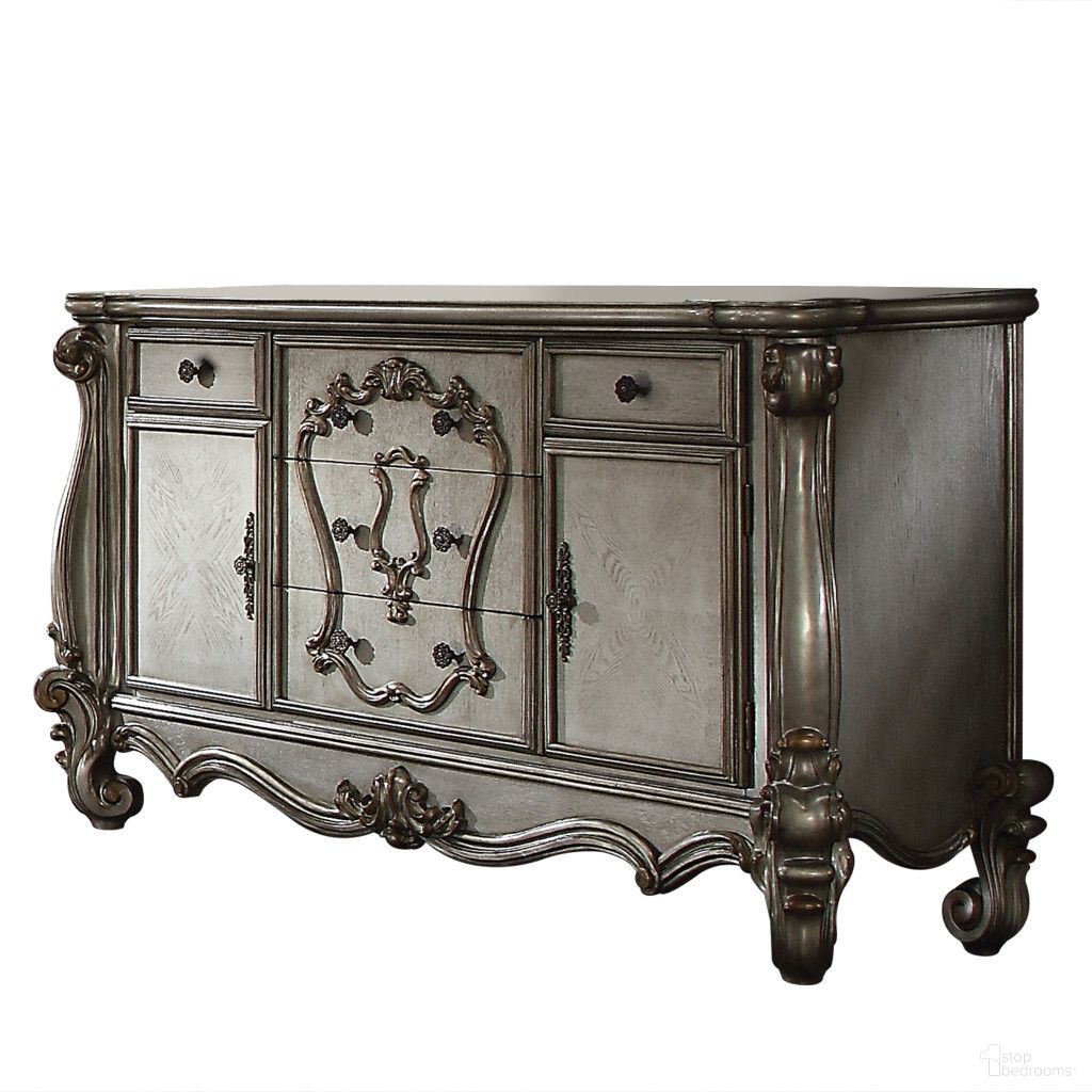 The appearance of 70 Inch Carved Scrollwork Wood and Polyresin Five Drawer Triple Dresser In Platinum designed by Homeroots in the traditional interior design. This platinum piece of furniture  was selected by 1StopBedrooms from  to add a touch of cosiness and style into your home. Sku: 490476. Material: Resin.