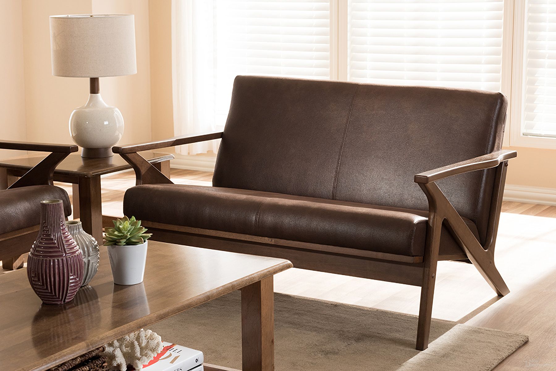 The appearance of Baxton Studio Bianca Mid-Century Modern Walnut Wood Dark Brown Distressed Faux Leather 2-Seater Loveseat designed by Baxton Studio in the transitional interior design. This dark brown piece of furniture was selected by 1StopBedrooms from Bianca Collection to add a touch of cosiness and style into your home. Sku: Bianca-Dark Brown/Walnut Brown-LS. Material: Faux Leather.