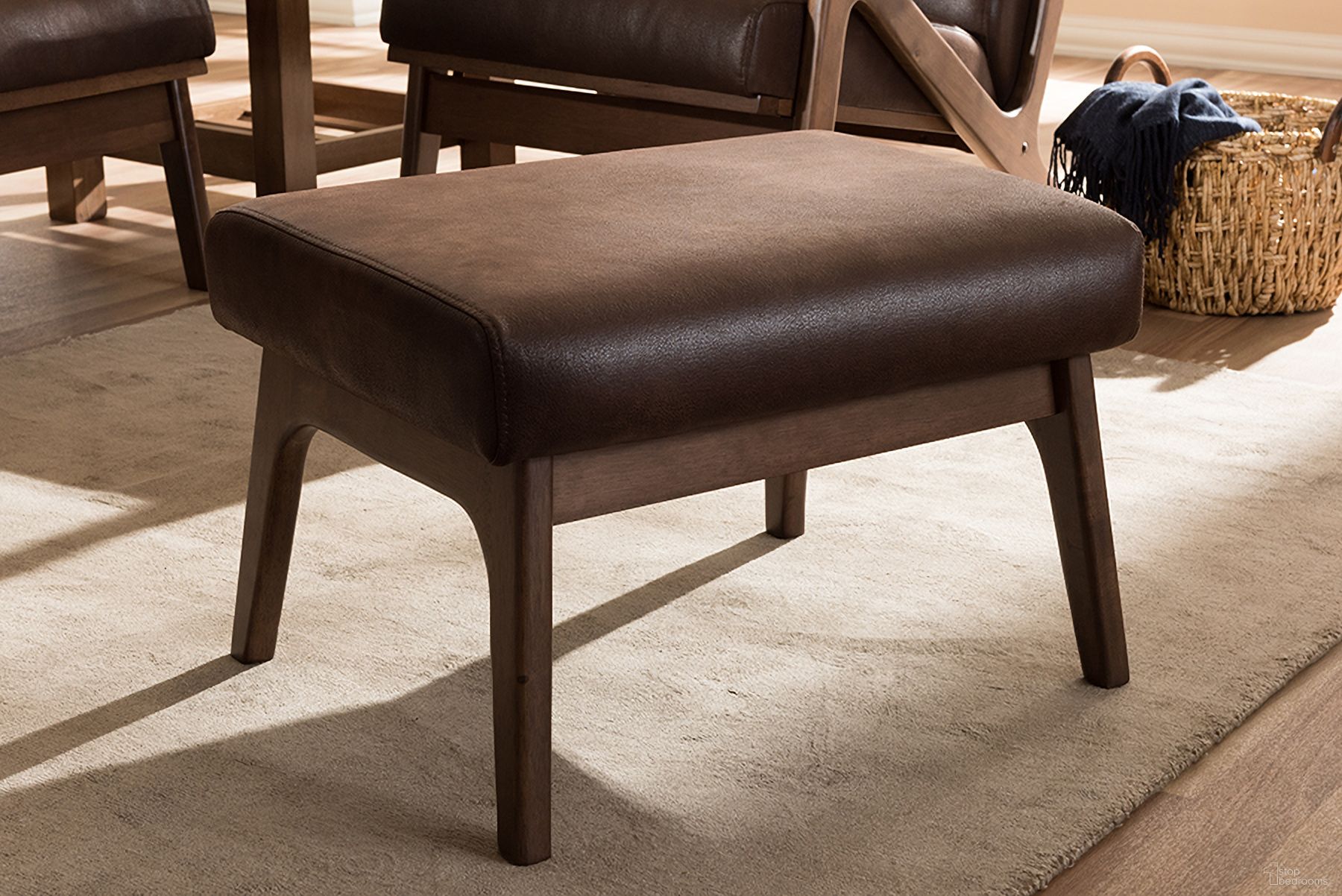 The appearance of Baxton Studio Bianca Mid-Century Modern Walnut Wood Dark Brown Distressed Faux Leather Ottoman designed by Baxton Studio in the transitional interior design. This dark brown piece of furniture was selected by 1StopBedrooms from Bianca Collection to add a touch of cosiness and style into your home. Sku: Bianca-Dark Brown/Walnut Brown-Otto. Material: Rubberwood.