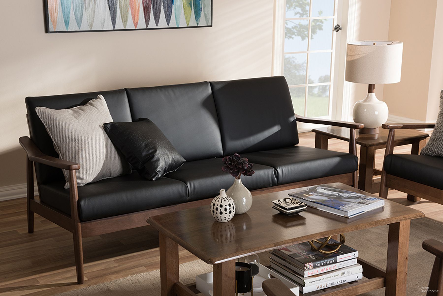 The appearance of Baxton Studio Venza Mid-Century Modern Walnut Wood Black Faux Leather 3-Seater Sofa designed by Baxton Studio in the transitional interior design. This black piece of furniture was selected by 1StopBedrooms from Venza Collection to add a touch of cosiness and style into your home. Sku: Venza-Black/Walnut Brown-SF. Material: Faux Leather.