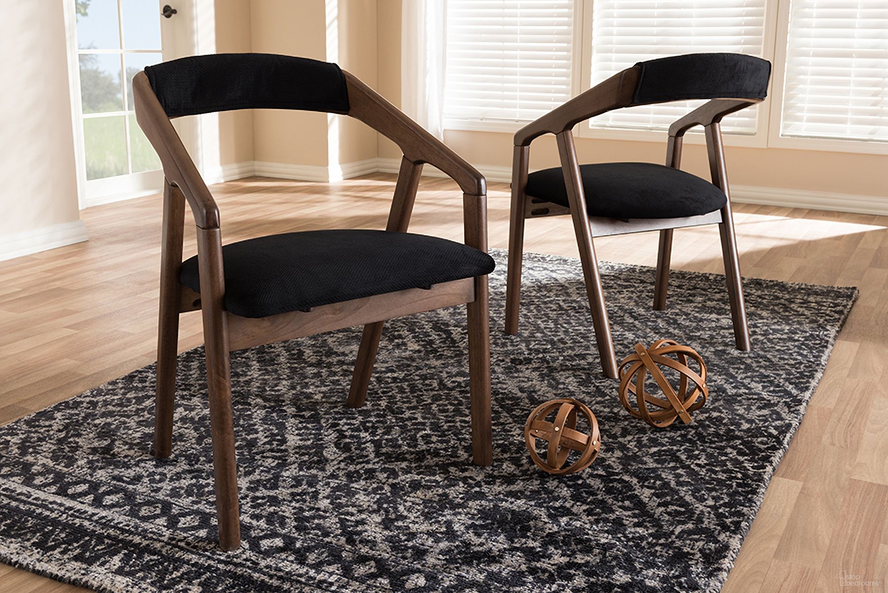 The appearance of Baxton Studio Wendy Mid-Century Modern Black Velvet And Walnut Medium Brown Wood Finishing Dining Chair (Set Of 2) designed by Baxton Studio in the transitional interior design. This black piece of furniture  was selected by 1StopBedrooms from Wendy Collection to add a touch of cosiness and style into your home. Sku: Walnut Sunburst Dining Chair. Material: Polyester. Chair Type: Arm Chair.