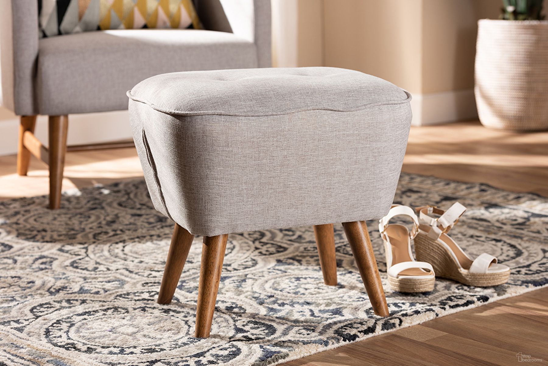 The appearance of Baxton Studio Petronelle Mid-Century Modern Greyish Beige Fabric Upholstered Walnut Brown Finished Wood Ottoman designed by Baxton Studio in the transitional interior design. This beige piece of furniture was selected by 1StopBedrooms from Petronelle Collection to add a touch of cosiness and style into your home. Sku: BBT5341-Greyish Beige. Material: Fabric.