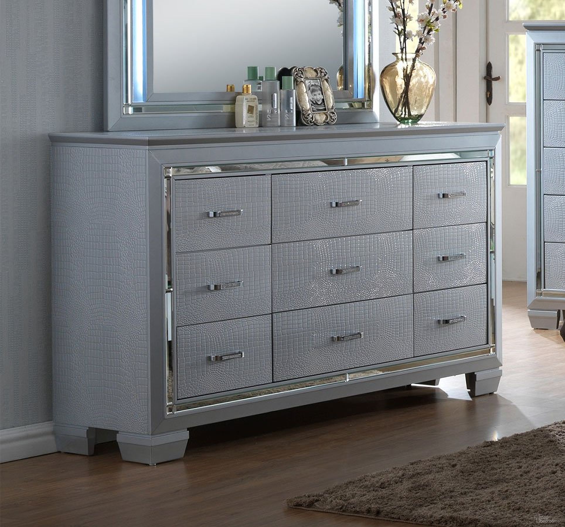 The appearance of Lillian Dresser designed by Crown Mark in the modern / contemporary interior design. This silver piece of furniture was selected by 1StopBedrooms from Lillian Collection to add a touch of cosiness and style into your home. Sku: B7100-1. Material: Wood.