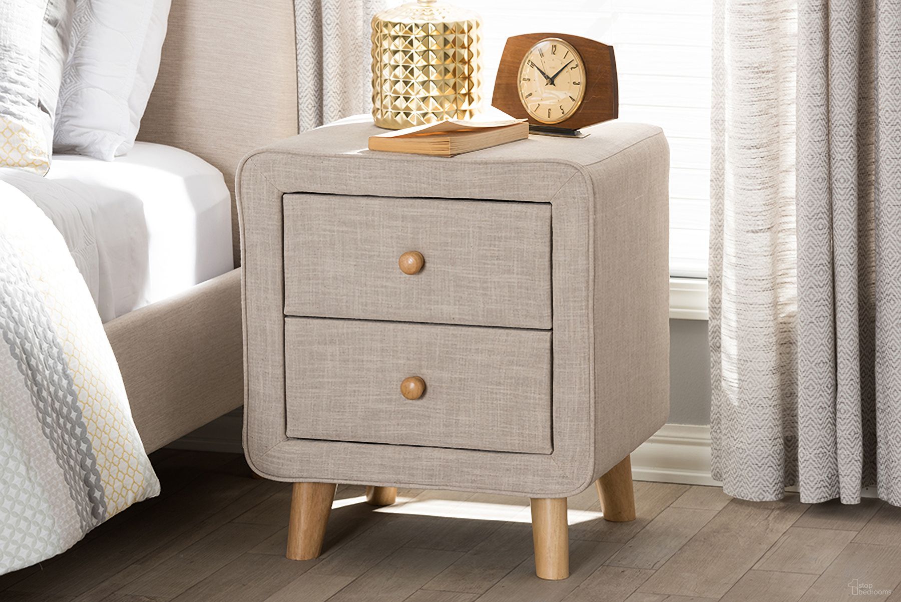 The appearance of Baxton Studio Jonesy Mid-Century Beige Linen Upholstered 2-Drawer Nightstand designed by Baxton Studio in the transitional interior design. This beige piece of furniture was selected by 1StopBedrooms from Jonesy Collection to add a touch of cosiness and style into your home. Sku: BBT3140-Beige-NS-XD02. Material: Fabric.