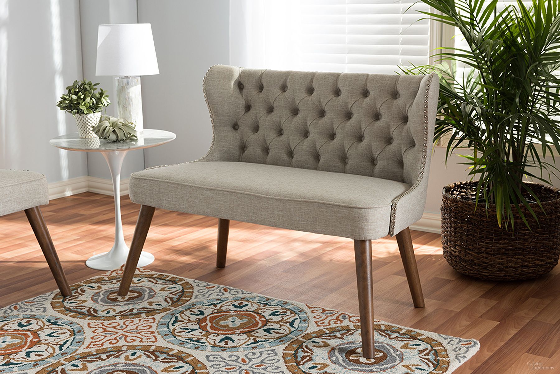 The appearance of Baxton Studio Scarlett Mid-Century Modern Brown Wood And Light Beige Fabric Upholstered Button-Tufting With Nail Heads Trim 2-Seater Loveseat Settee designed by Baxton Studio in the transitional interior design. This light beige piece of furniture  was selected by 1StopBedrooms from Scarlett Collection to add a touch of cosiness and style into your home. Sku: BBT8017-LS-Beige-H1217-3. Material: Polyester.