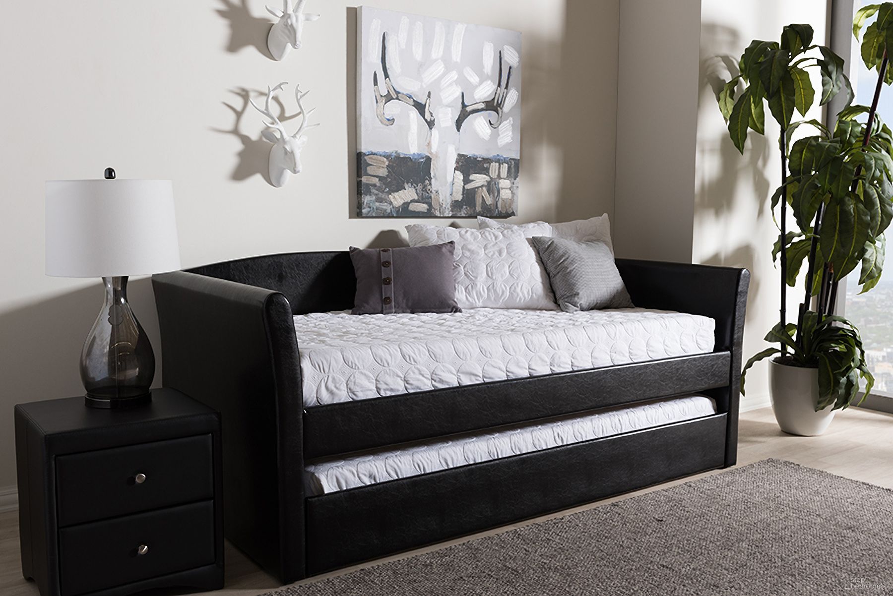 The appearance of Baxton Studio Camino Modern And Contemporary Black Faux Leather Upholstered Daybed With Guest Trundle Bed designed by Baxton Studio in the modern / contemporary interior design. This black piece of furniture was selected by 1StopBedrooms from Camino Collection to add a touch of cosiness and style into your home. Sku: CF8756-Black-Day Bed. Bed Type: Daybed. Material: MDF.