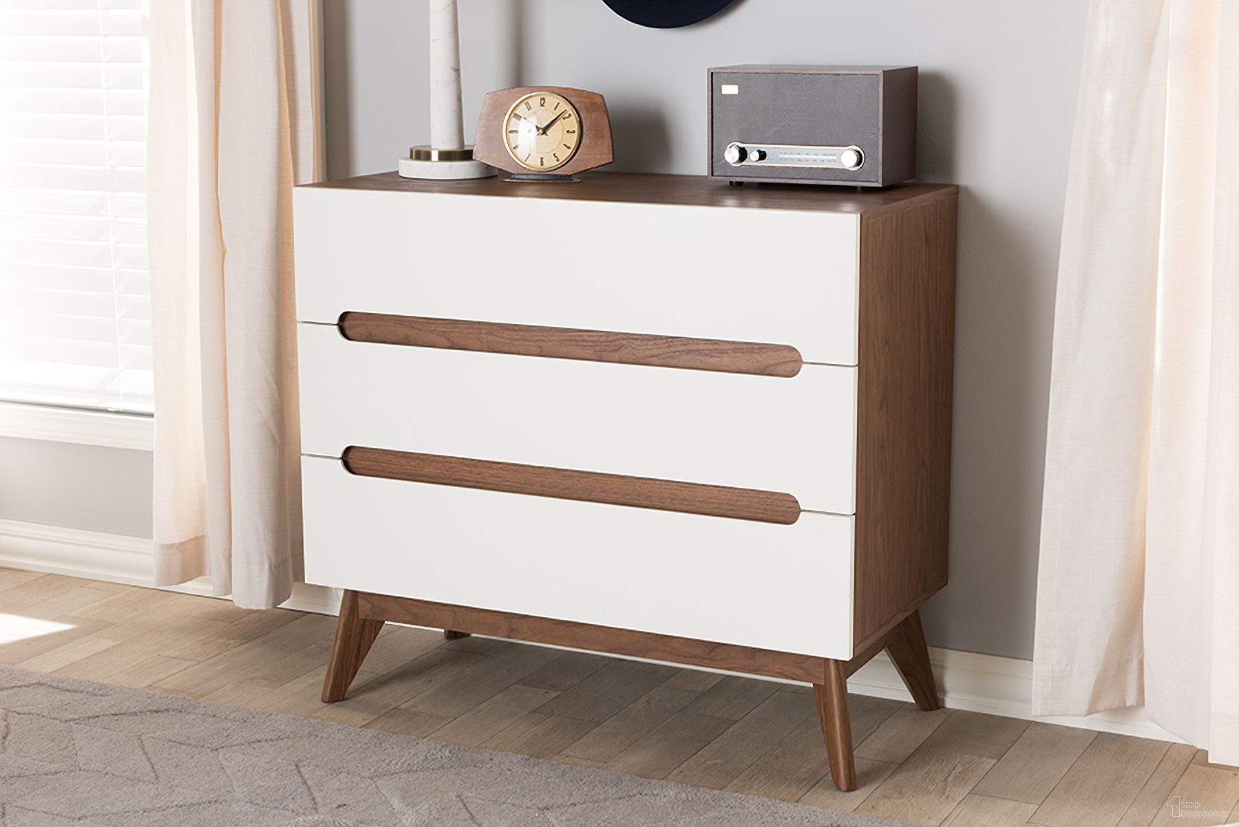 The appearance of Baxton Studio Calypso Mid-Century Modern White And Walnut Wood 3-Drawer Storage Chest designed by Baxton Studio in the transitional interior design. This white piece of furniture was selected by 1StopBedrooms from Calypso Collection to add a touch of cosiness and style into your home. Sku: Calypso-Walnut/White-3DW-Chest. Material: Particle Board.