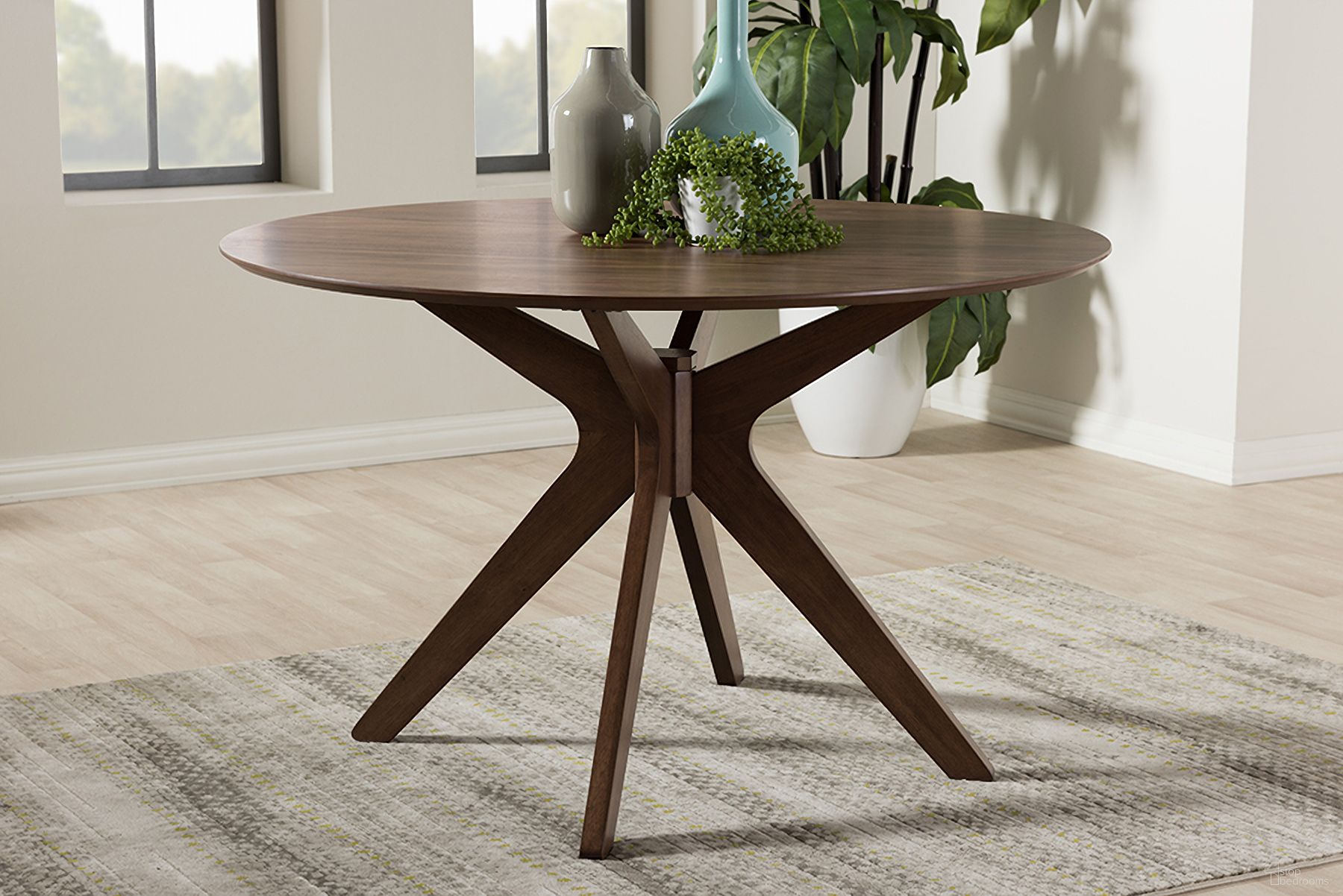 The appearance of Baxton Studio Monte Mid-Century Modern Walnut Wood 47-Inch Round Dining Table designed by Baxton Studio in the transitional interior design. This walnut piece of furniture was selected by 1StopBedrooms from Monte Collection to add a touch of cosiness and style into your home. Sku: Monte-Walnut-Round-DT. Table Base Style: Trestle. Table Top Shape: Round. Material: Rubberwood. Size: 47".