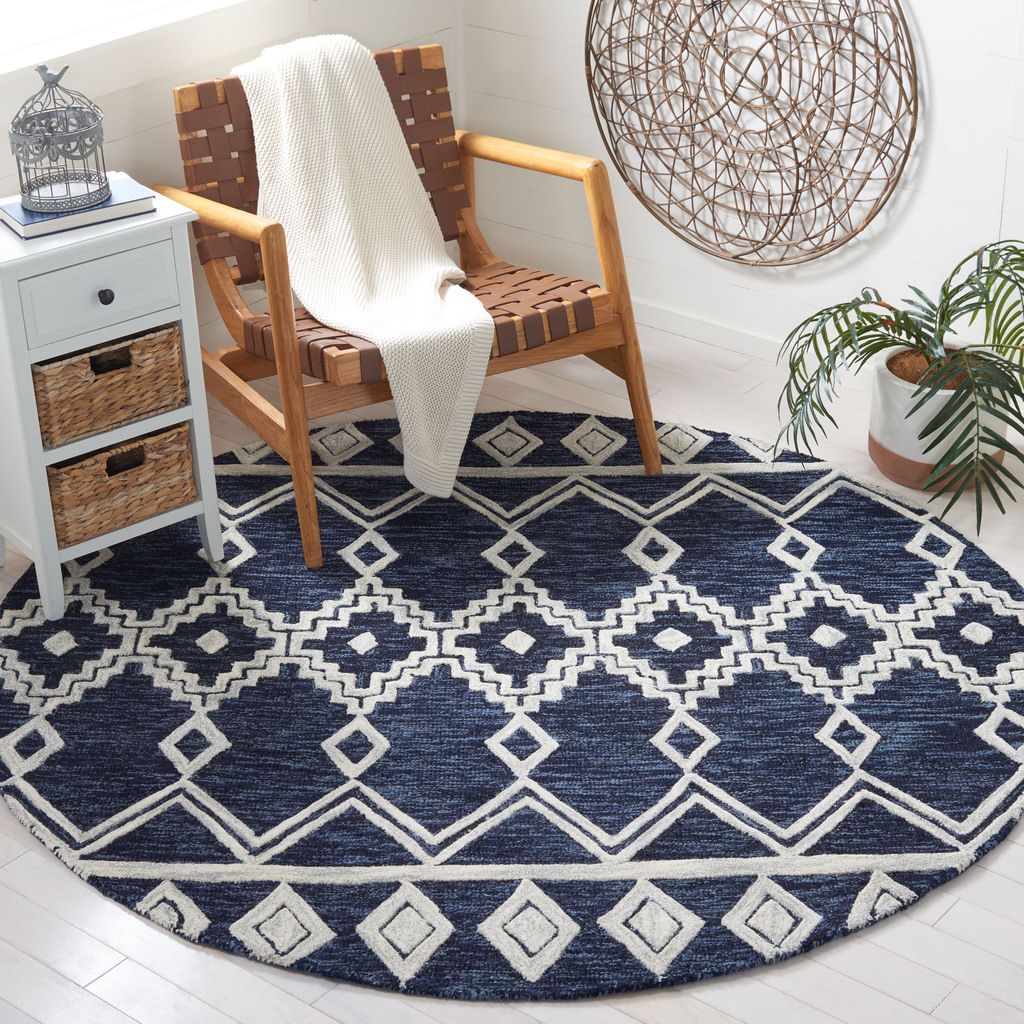 The appearance of Abstract Hand Tufted Navy and Ivory 6' x 6' Round Rugs designed by Safavieh in the modern / contemporary interior design. This navy and ivory piece of furniture was selected by 1StopBedrooms from Abstract Collection to add a touch of cosiness and style into your home. Sku: ABT851N-6R. Material: Wool.