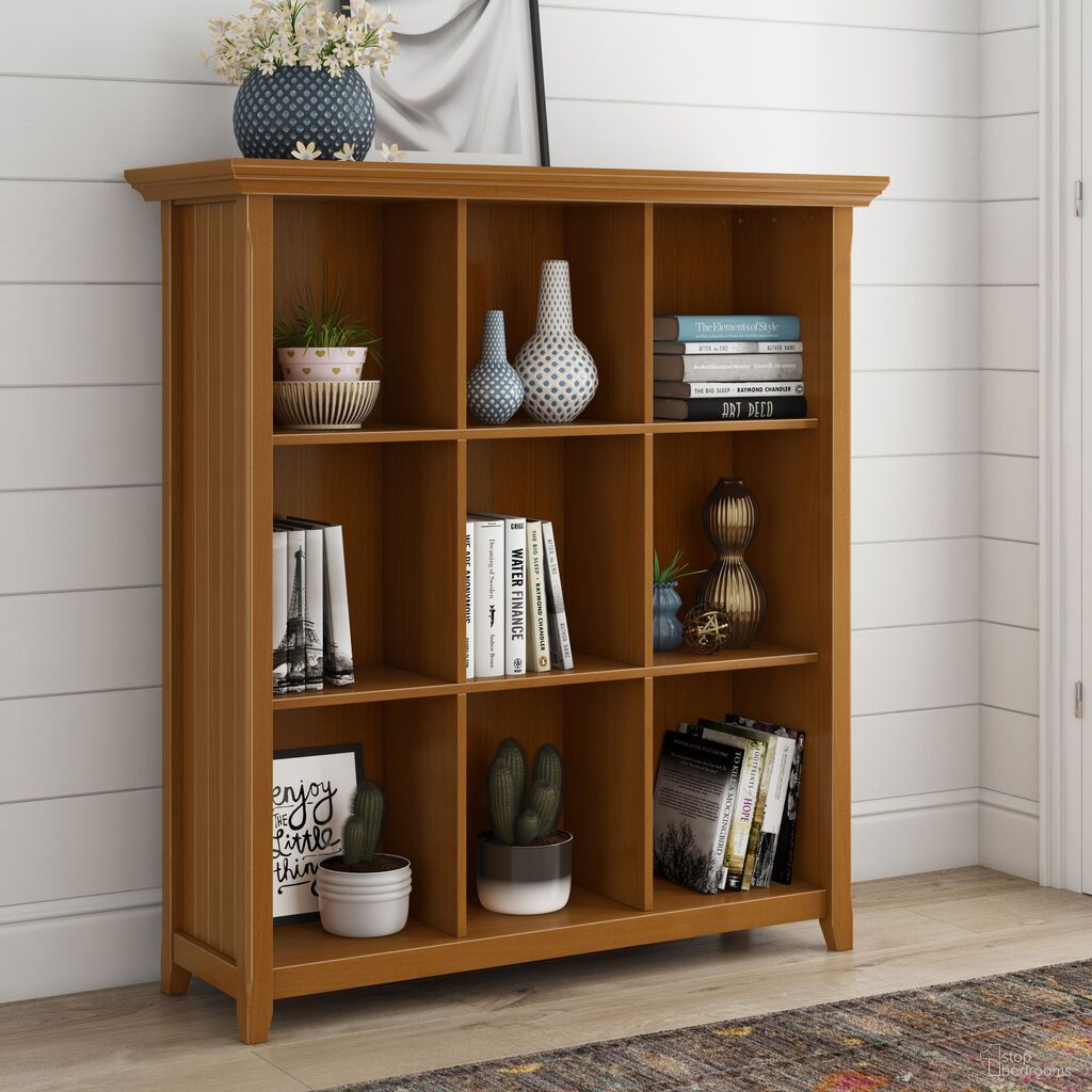 The appearance of Acadian Solid Wood 9 Cube Bookcase and Storage Unit In Light Golden Brown designed by Simpli Home in the transitional interior design. This light golden brown piece of furniture  was selected by 1StopBedrooms from Acadian Collection to add a touch of cosiness and style into your home. Sku: AXCACA21-LGB. Material: Pine.