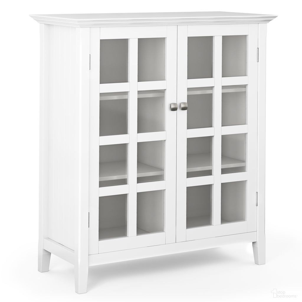 The appearance of Acadian Solid Wood Medium Storage Cabinet In White designed by Simpli Home in the transitional interior design. This white piece of furniture  was selected by 1StopBedrooms from Acadian Collection to add a touch of cosiness and style into your home. Sku: AXCACA15-WH. Material: Pine.