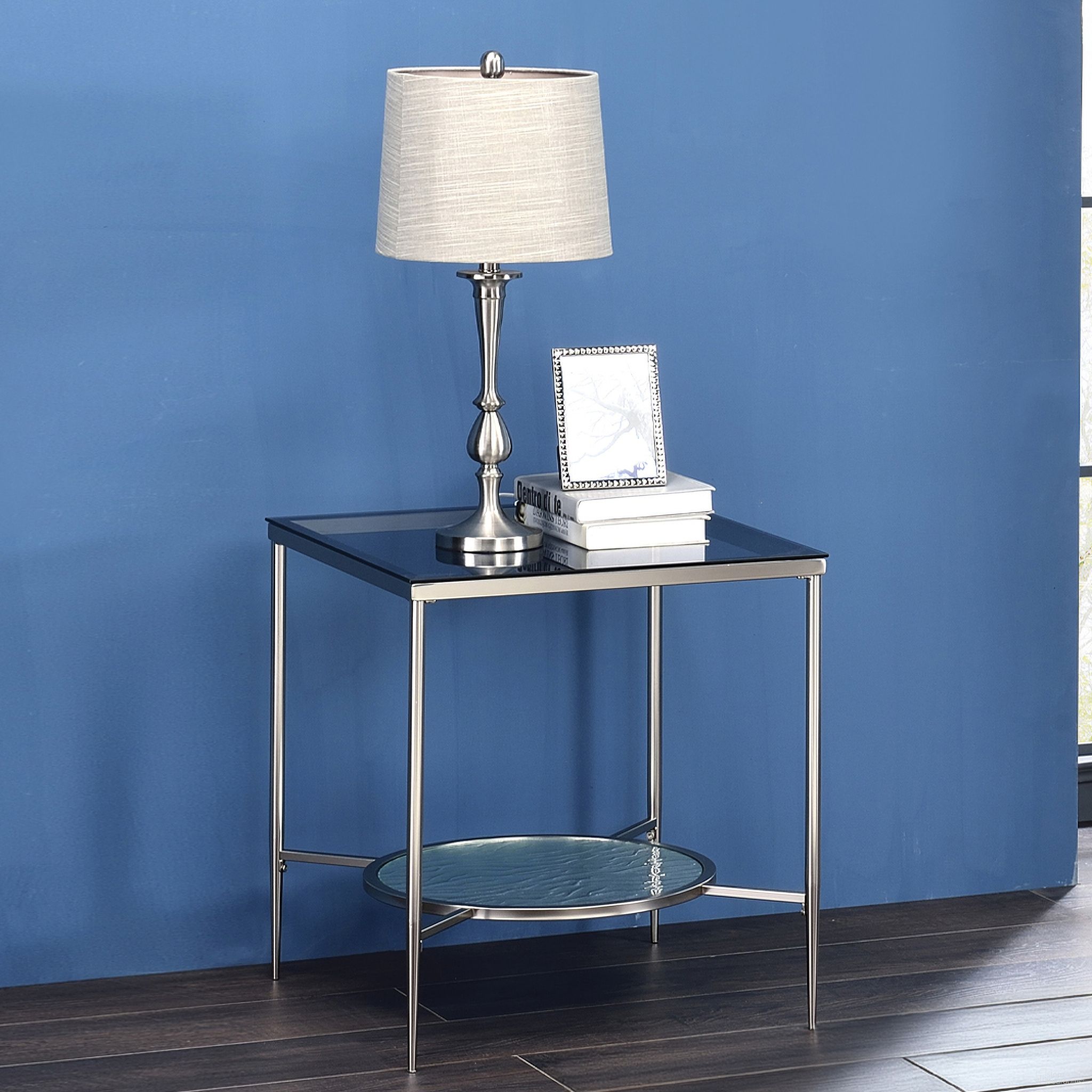 The appearance of Acme Adelrik End Table designed by ACME in the modern / contemporary interior design. This chrome piece of furniture  was selected by 1StopBedrooms from Adelrik Collection to add a touch of cosiness and style into your home. Sku: LV00575. Material: Metal.