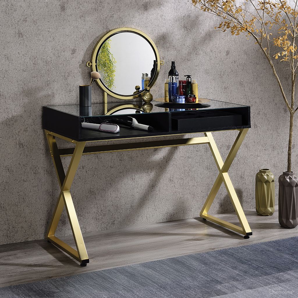 The appearance of Acme Coleen Vanity Desk With Mirror And Jewelry Tray In Black And Gold Finish designed by ACME in the modern / contemporary interior design. This black and gold piece of furniture was selected by 1StopBedrooms from Coleen Collection to add a touch of cosiness and style into your home. Sku: AC00669. Material: Wood.