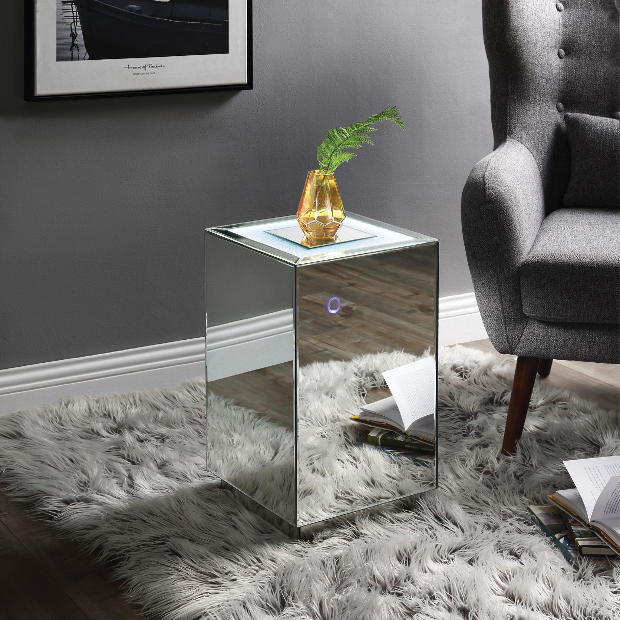 The appearance of Acme Nyoka Accent Table With Led In Mirrored And Faux Gems designed by ACME in the glam interior design. This mirrored piece of furniture  was selected by 1StopBedrooms from Nowles Collection to add a touch of cosiness and style into your home. Sku: 97704. Material: MDF.