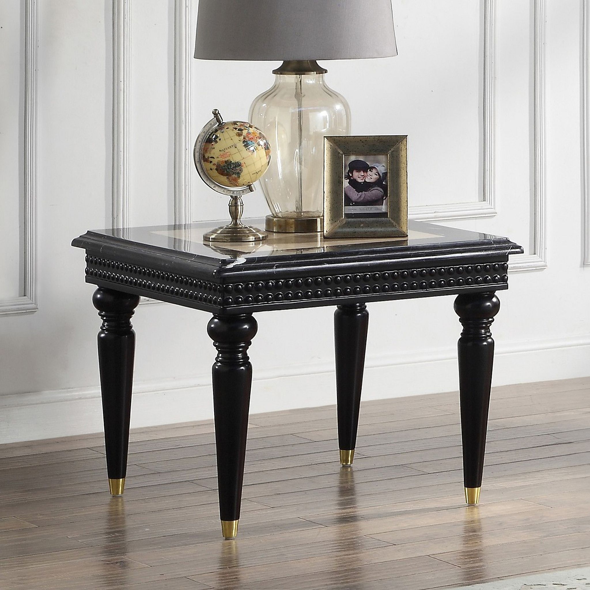 The appearance of Acme Tayden End Table With Marble Top designed by ACME in the transitional interior design. This black piece of furniture was selected by 1StopBedrooms from Tayden Collection to add a touch of cosiness and style into your home. Sku: LV01159. Material: Wood.