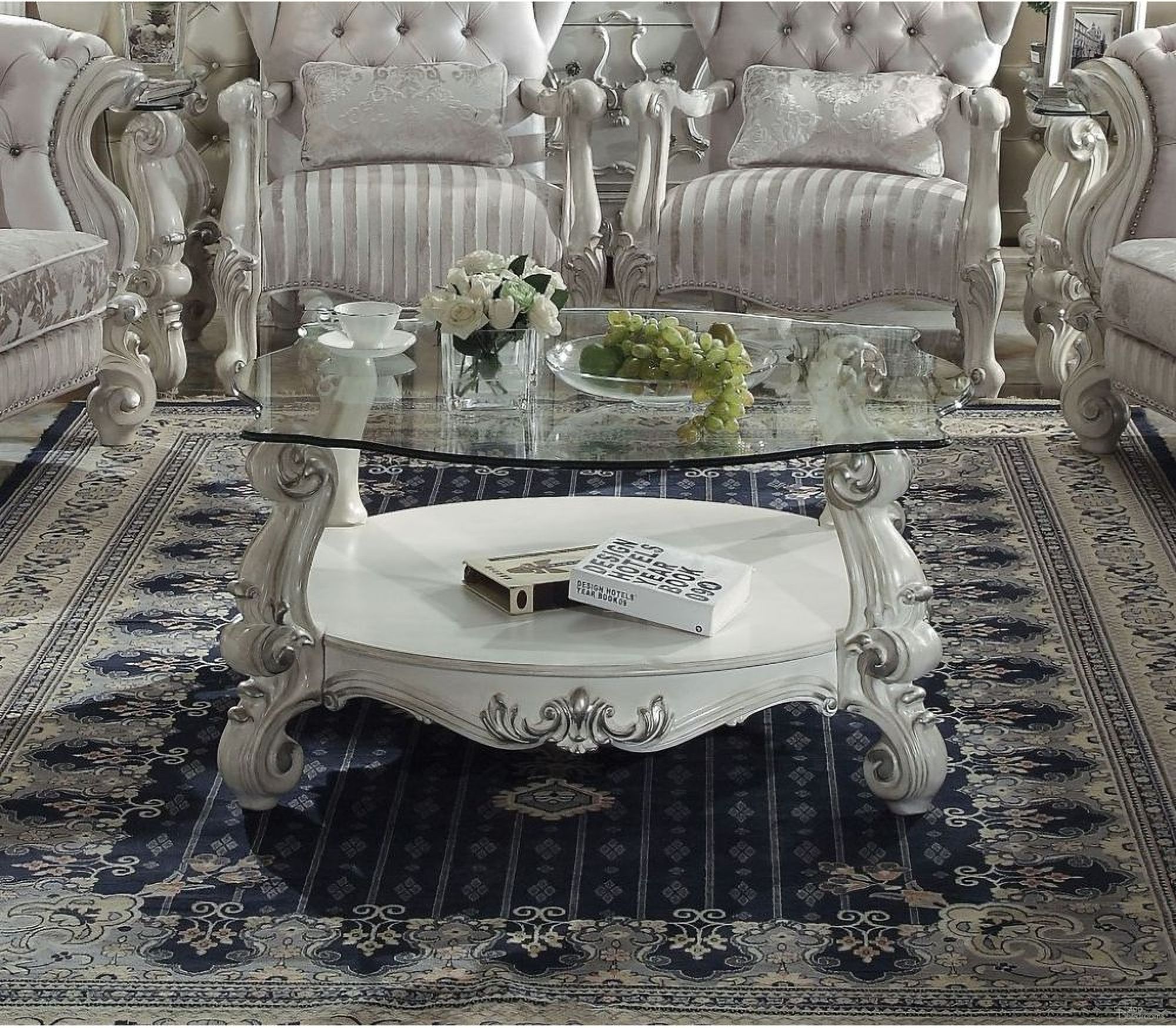 The appearance of Acme Versailles Glass Top Coffee in Antique White designed by ACME in the rustic / southwestern interior design. This white piece of furniture was selected by 1StopBedrooms from Versailles Collection to add a touch of cosiness and style into your home. Sku: 82085ST;82086GL. Material: Glass.