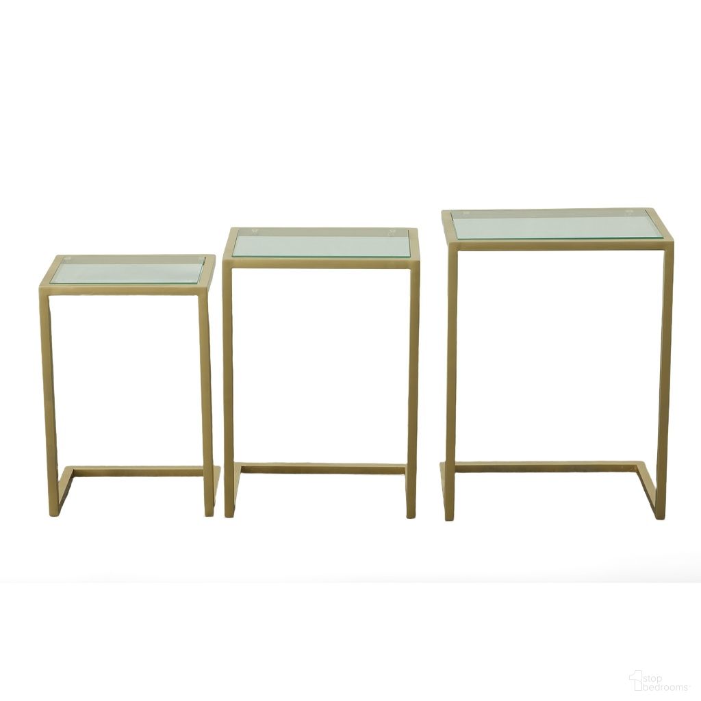 The appearance of Addison Nesting Table Set In Glass Top and Gold Base designed by Carolina Living in the modern / contemporary interior design. This clear/gold piece of furniture  was selected by 1StopBedrooms from Addison Collection to add a touch of cosiness and style into your home. Sku: WSS-2016G-GLD. Material: Tempered Glass.