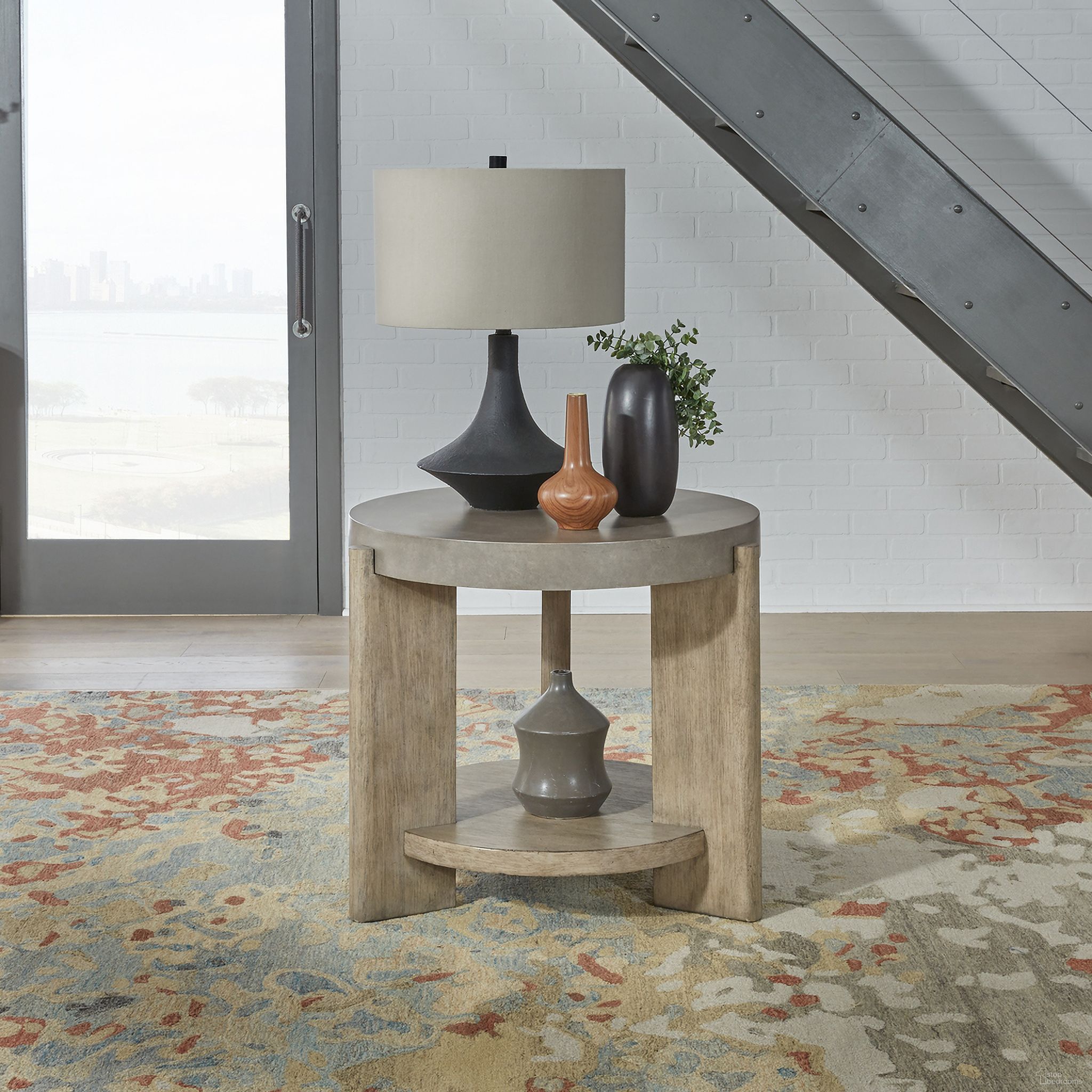 The appearance of Affinity Round End Table In Brown designed by Liberty in the modern / contemporary interior design. This brown piece of furniture  was selected by 1StopBedrooms from Affinity Collection to add a touch of cosiness and style into your home. Sku: 674-OT1020. Material: Wood.