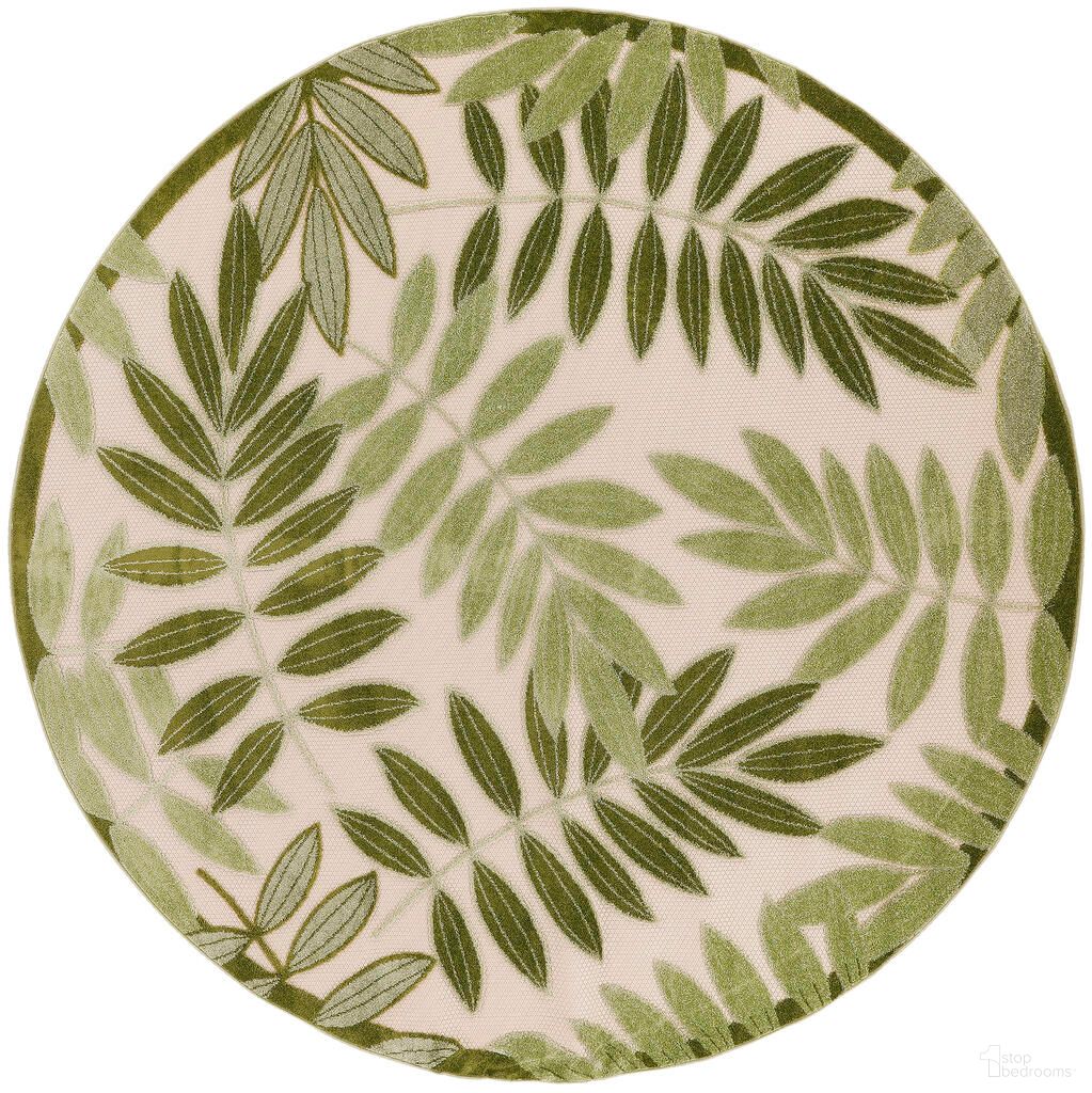 The appearance of Aloha 7'10" x 7'10" Round Outdoor Rug In Ivory and Green designed by Nourison in the indoor/outdoor interior design. This ivory and green piece of furniture was selected by 1StopBedrooms from Aloha Collection to add a touch of cosiness and style into your home. Sku: 99446953308. Material: Polypropylene.