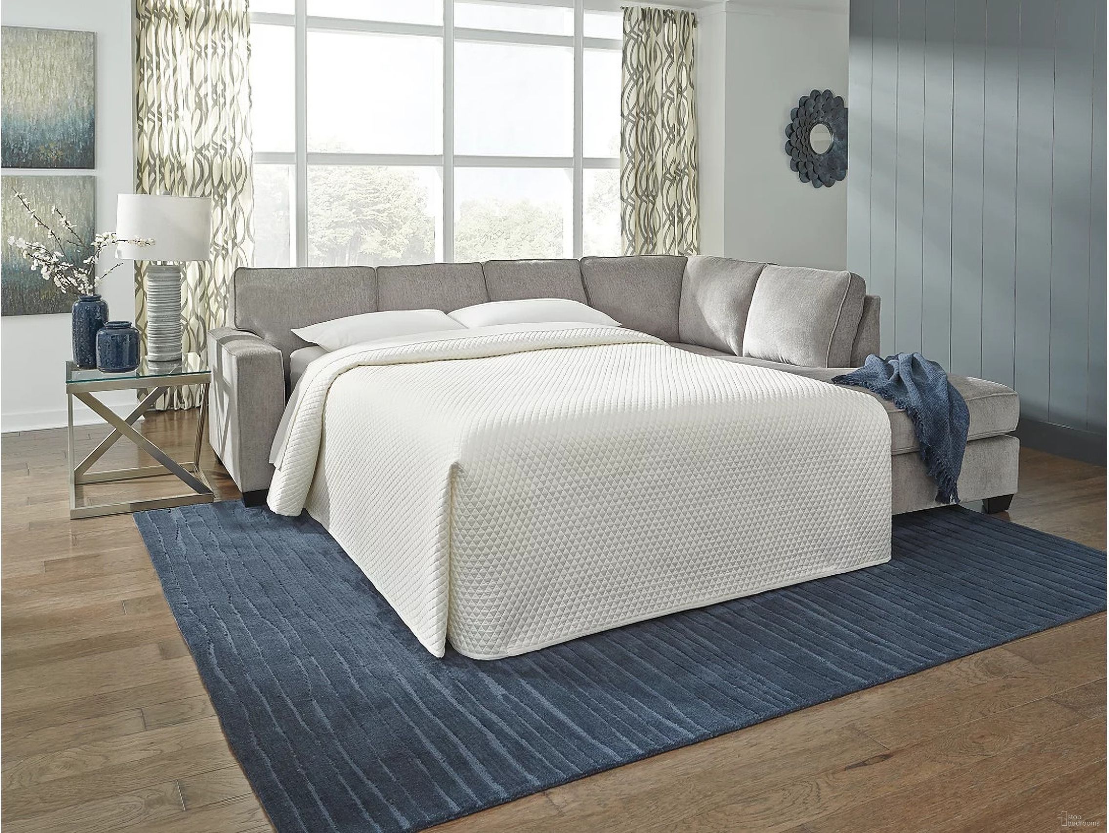 The appearance of Altari 2-Piece Sleeper Sectional and Ottoman In Alloy designed by Signature Design by Ashley in the transitional interior design. This alloy piece of furniture  was selected by 1StopBedrooms from Altari Collection to add a touch of cosiness and style into your home. Sku: 8721410;8721408;8721417. Material: Fabric. Layout: Sofa & Chaise.