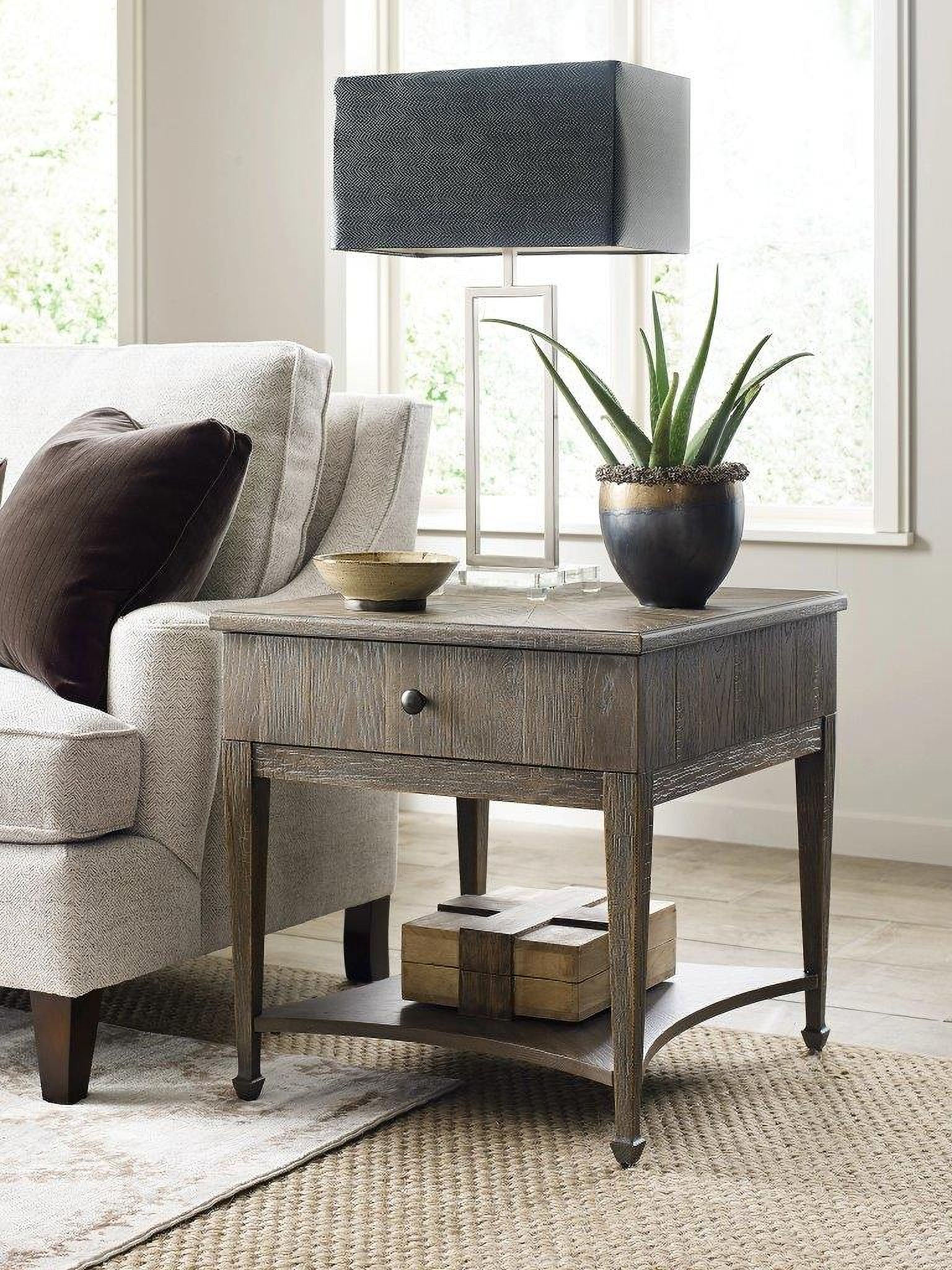 The appearance of American Drew Emporium Carmine Drawer End Table designed by American Drew in the transitional interior design. This dark stain piece of furniture  was selected by 1StopBedrooms from Emporium Collection to add a touch of cosiness and style into your home. Sku: 012-915. Material: Wood.
