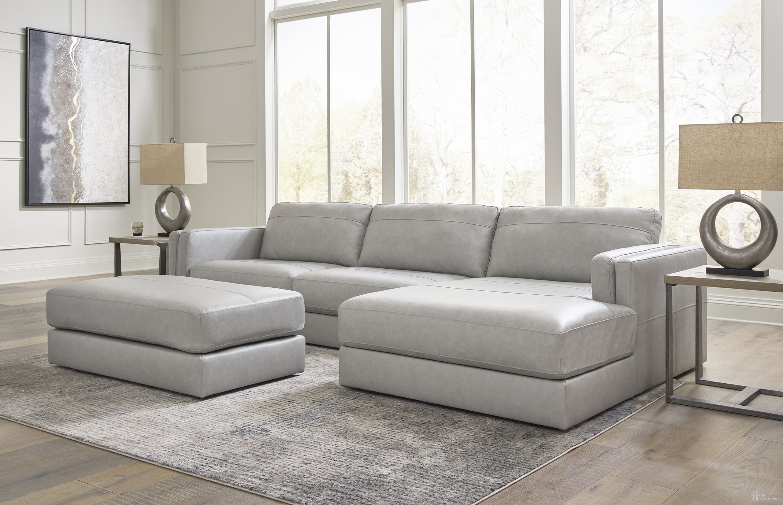 The appearance of Amiata 2-Piece Sectional with Chaise and Ottoman In Glacier designed by Signature Design by Ashley in the modern / contemporary interior design. This glacier piece of furniture was selected by 1StopBedrooms from Amiata Collection to add a touch of cosiness and style into your home. Sku: 5740408;5740417;5740466. Material: Leather.