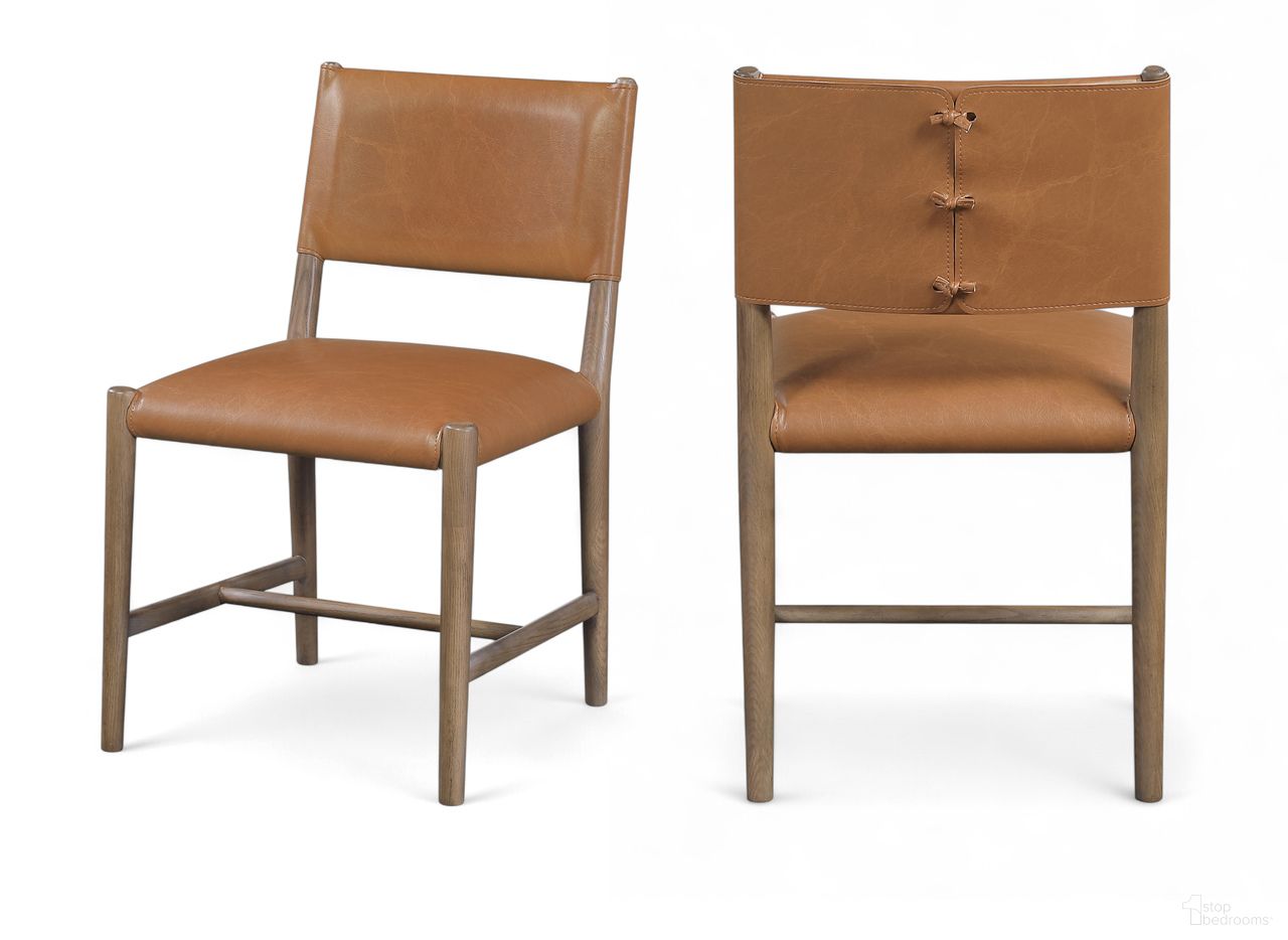 The appearance of Andie Vegan Leather Upholstered Dining Chair Set of 2 In Cognac and Stained Brown designed by Meridian in the modern / contemporary interior design. This cognac/stained brown piece of furniture was selected by 1StopBedrooms from Andie Collection to add a touch of cosiness and style into your home. Sku: 88075Cognac-C. Material: Vegan Leather. Chair Type: Side Chair.