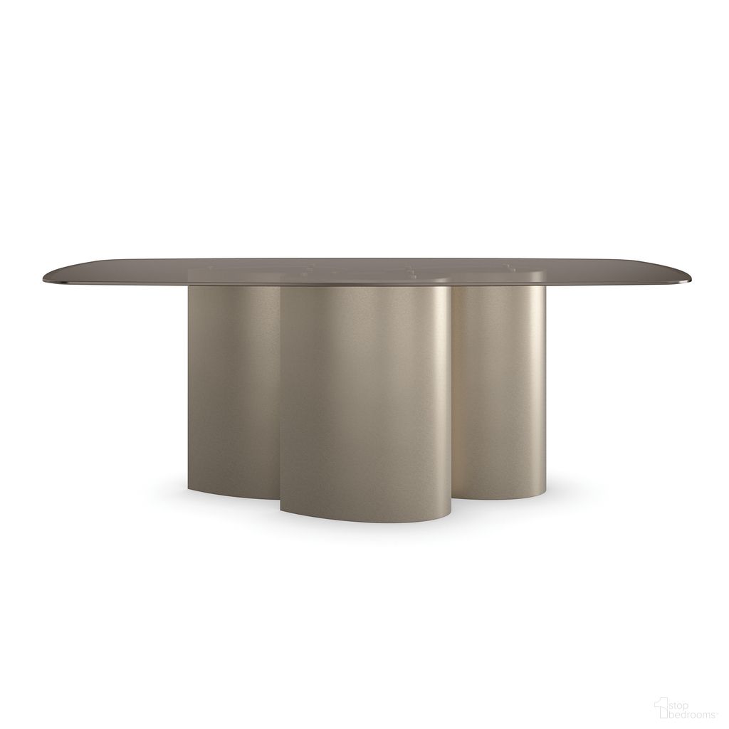 The appearance of Aphelion 3 Dining Table In Gold designed by Caracole in the modern / contemporary interior design. This gold piece of furniture  was selected by 1StopBedrooms from Aphelion Collection to add a touch of cosiness and style into your home. Sku: CLA-023-201B;GLA-8044-001T. Table Base Style: Pedestal. Material: Metal. Table Top Shape: Rectangular. Size: 44" x 80".