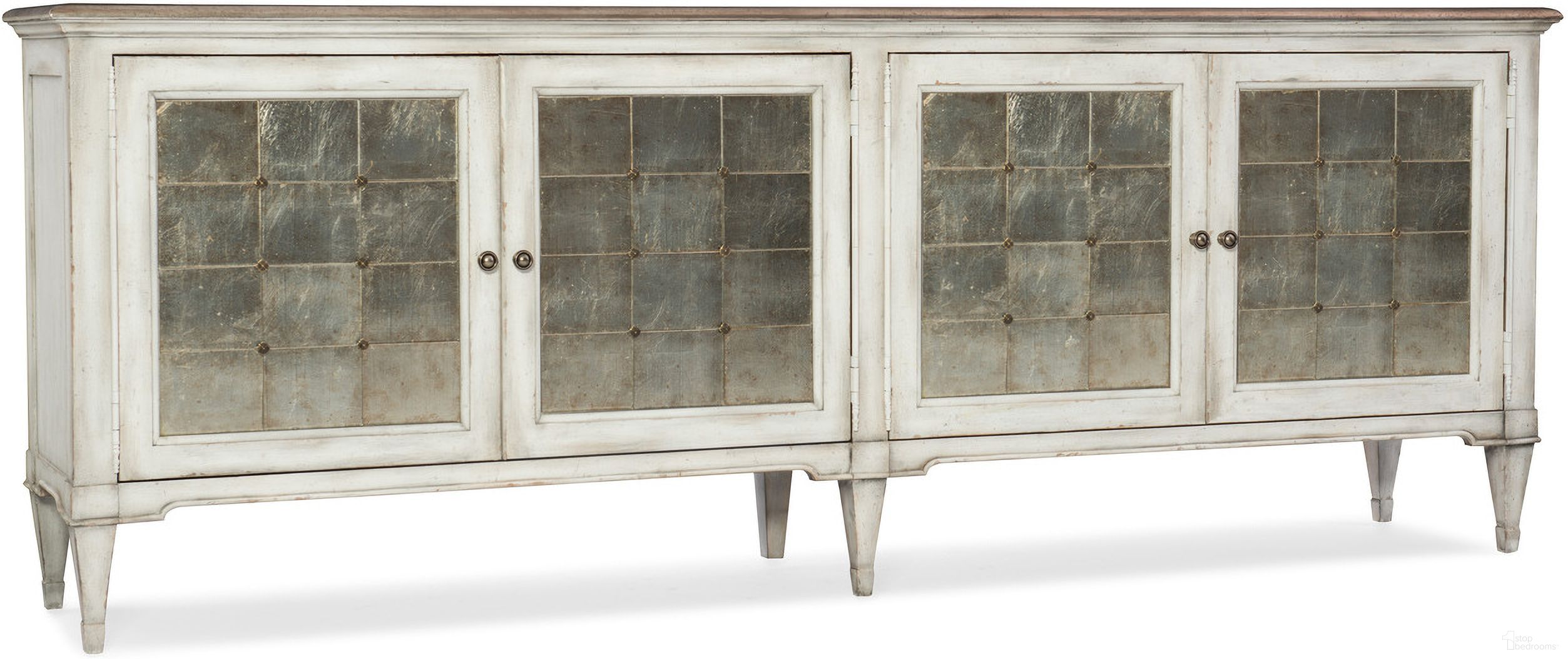 The appearance of Melange Arabella White 4 Door Credenza designed by Hooker in the traditional interior design. This white piece of furniture  was selected by 1StopBedrooms from Melange Collection to add a touch of cosiness and style into your home. Sku: 1610-85006-WH. Material: Maple.