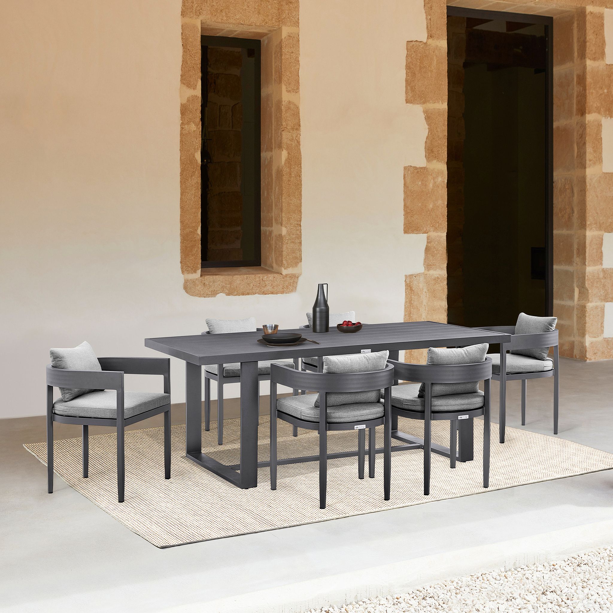 The appearance of Argiope Outdoor Patio 7-Piece Dining Table Set In Aluminum with Gray Cushions designed by Armen Living in the modern / contemporary interior design. This dark gray piece of furniture was selected by 1StopBedrooms from Argiope Collection to add a touch of cosiness and style into your home. Sku: 795154122066;795154122066;795154122066;795154122073. Table Base Style: Trestle. Material: Aluminum.