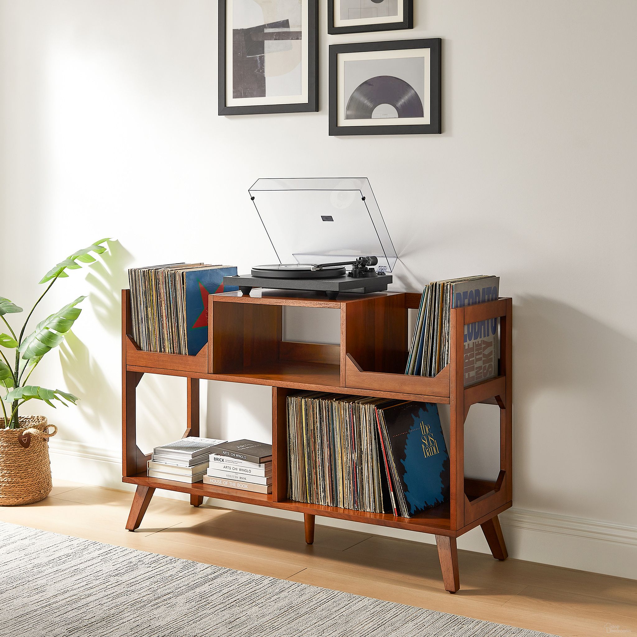 The appearance of Asheville Large Record Storage Console In Walnut designed by Crosley Brands in the transitional interior design. This walnut piece of furniture was selected by 1StopBedrooms from Asheville Collection to add a touch of cosiness and style into your home. Sku: CF1148-WA. Material: MDF.