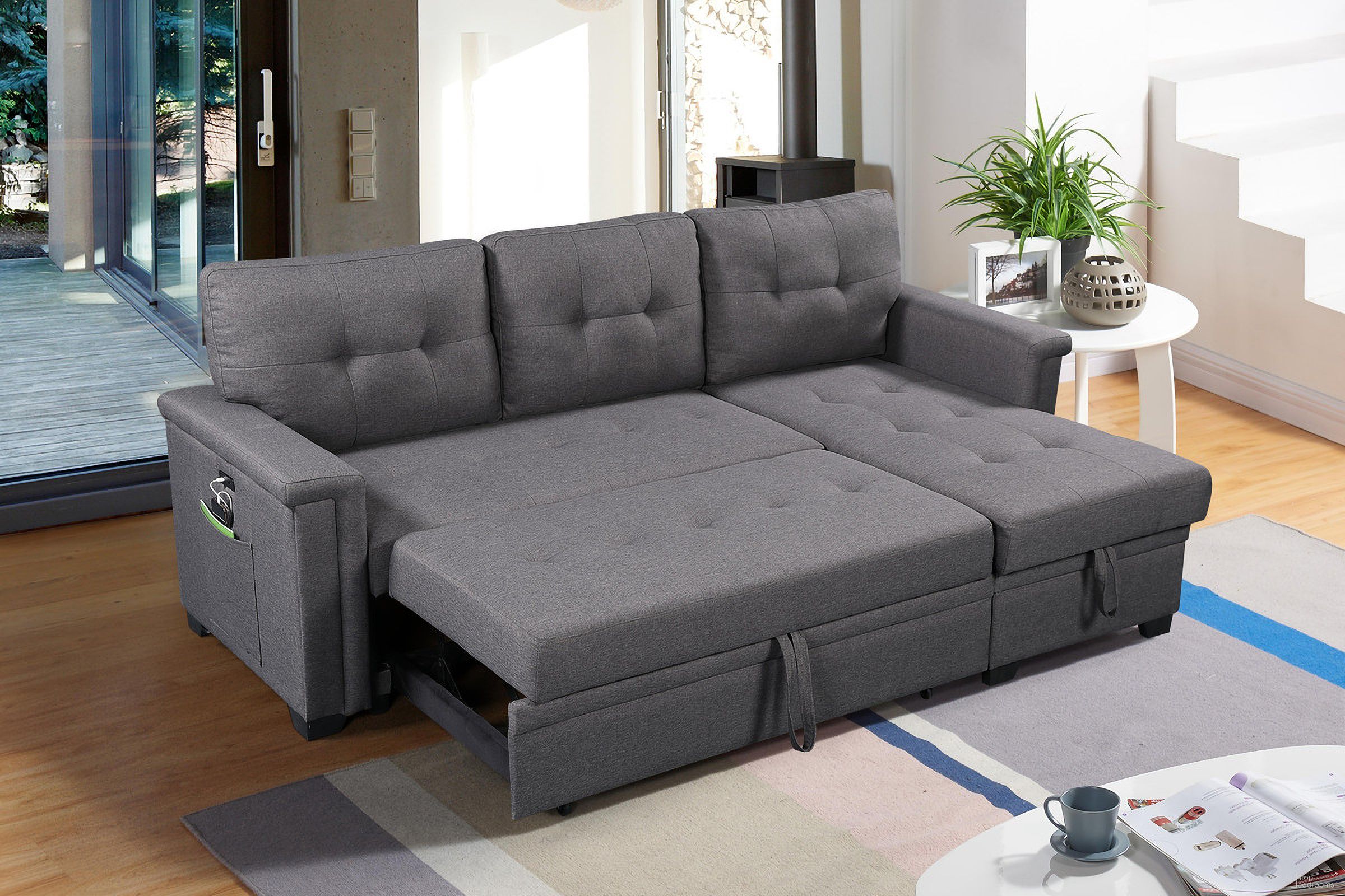The appearance of Ashlyn Dark Gray Reversible Sleeper Sectional Sofa With Storage Chaise designed by Lilola Home in the modern / contemporary interior design. This dark grey piece of furniture was selected by 1StopBedrooms from Ashlyn Collection to add a touch of cosiness and style into your home. Sku: 81382-A-3;81382-C-2;81382-L-1. Material: Wood. Layout: Sofa & Chaise.