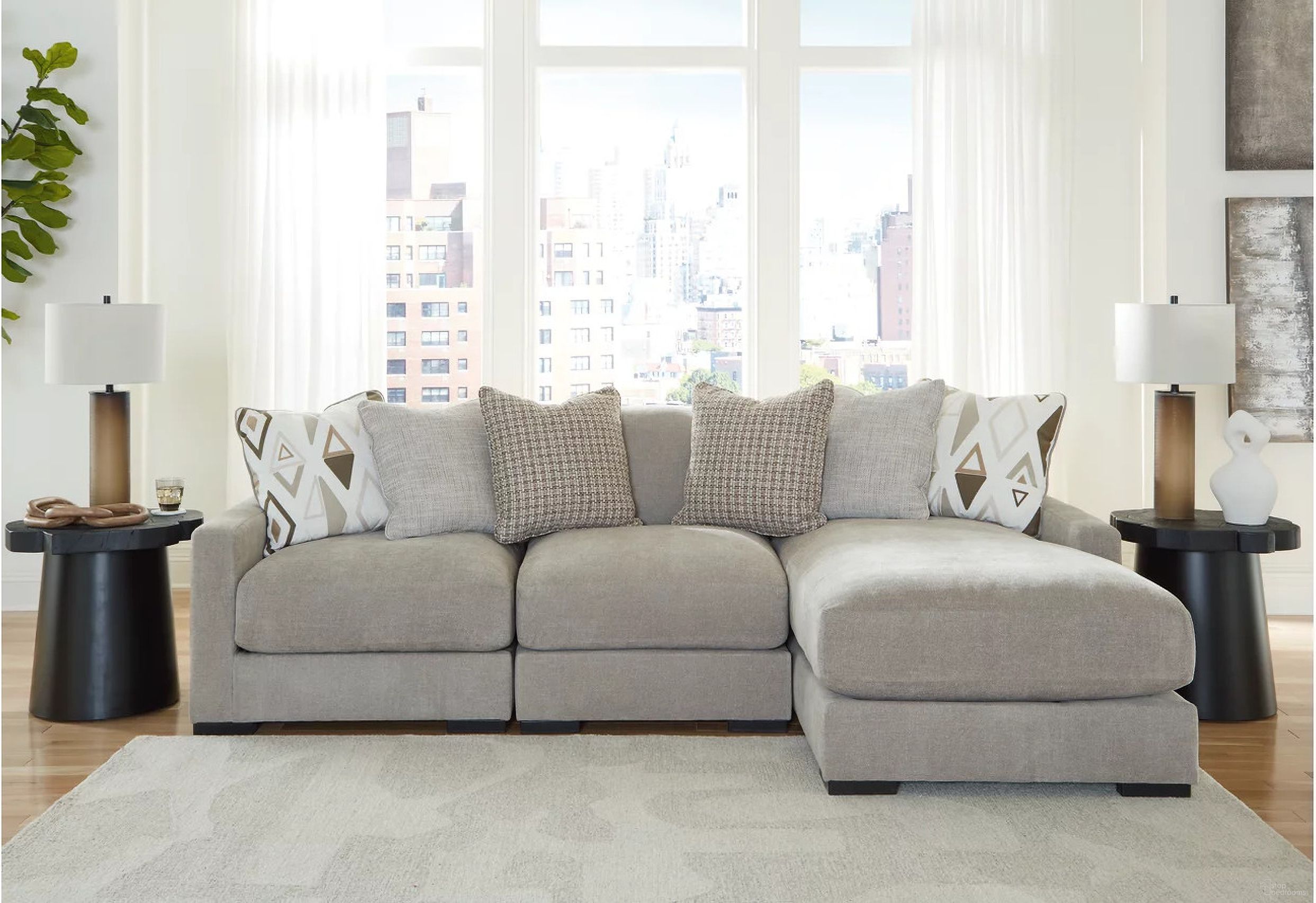 The appearance of Aslan Court 3-Piece Sofa Sectional with Chaise In Pebble designed by Signature Design by Ashley in the modern / contemporary interior design. This pebble piece of furniture was selected by 1StopBedrooms from Aslan Court Collection to add a touch of cosiness and style into your home. Sku: 2030564;2030546;2030517. Material: Polyester.