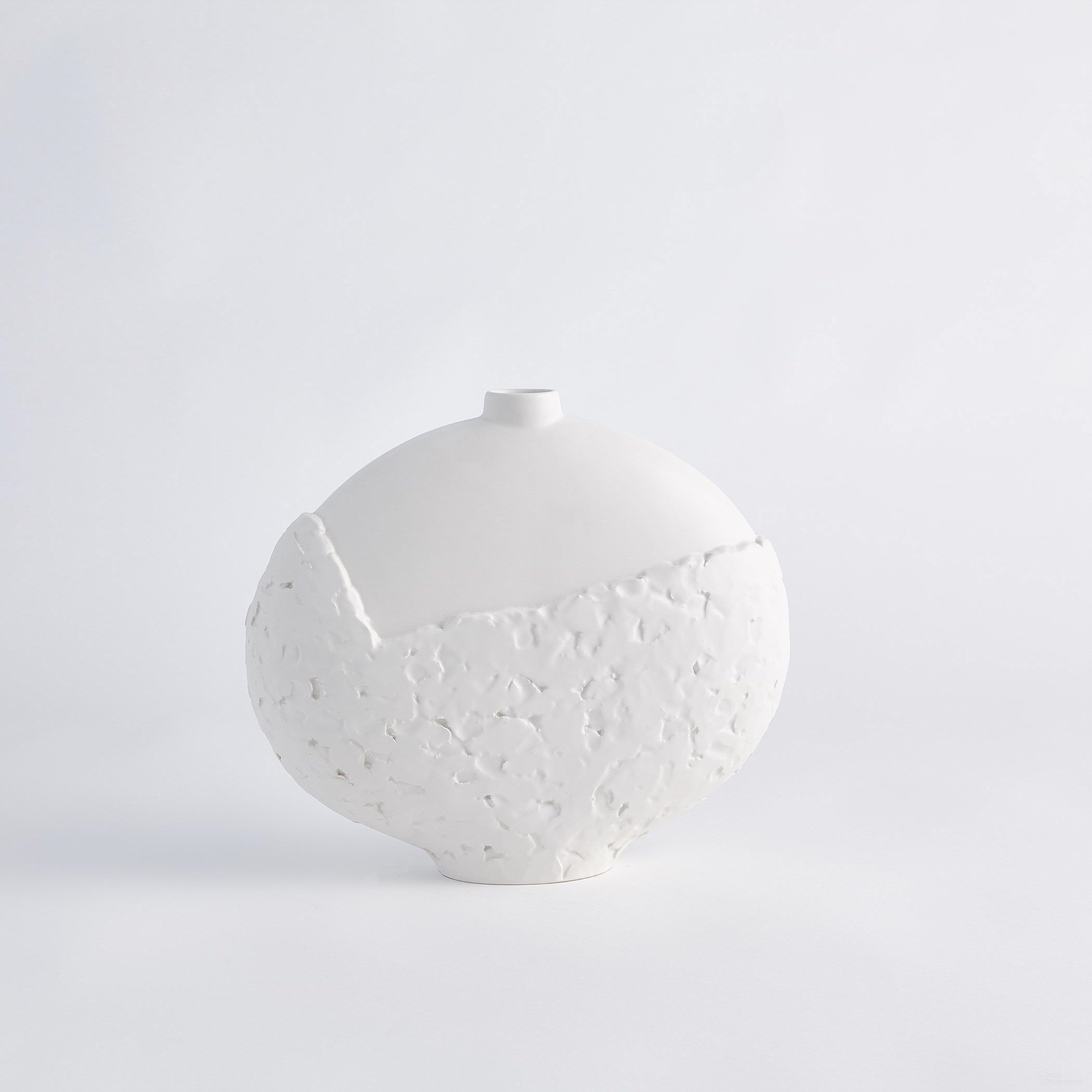 The appearance of Asymmetrical Stipple Small Vase In Matte White designed by Global Views in the modern / contemporary interior design. This white piece of furniture  was selected by 1StopBedrooms from Asymmetrical Collection to add a touch of cosiness and style into your home. Sku: 710369. Material: Ceramic.