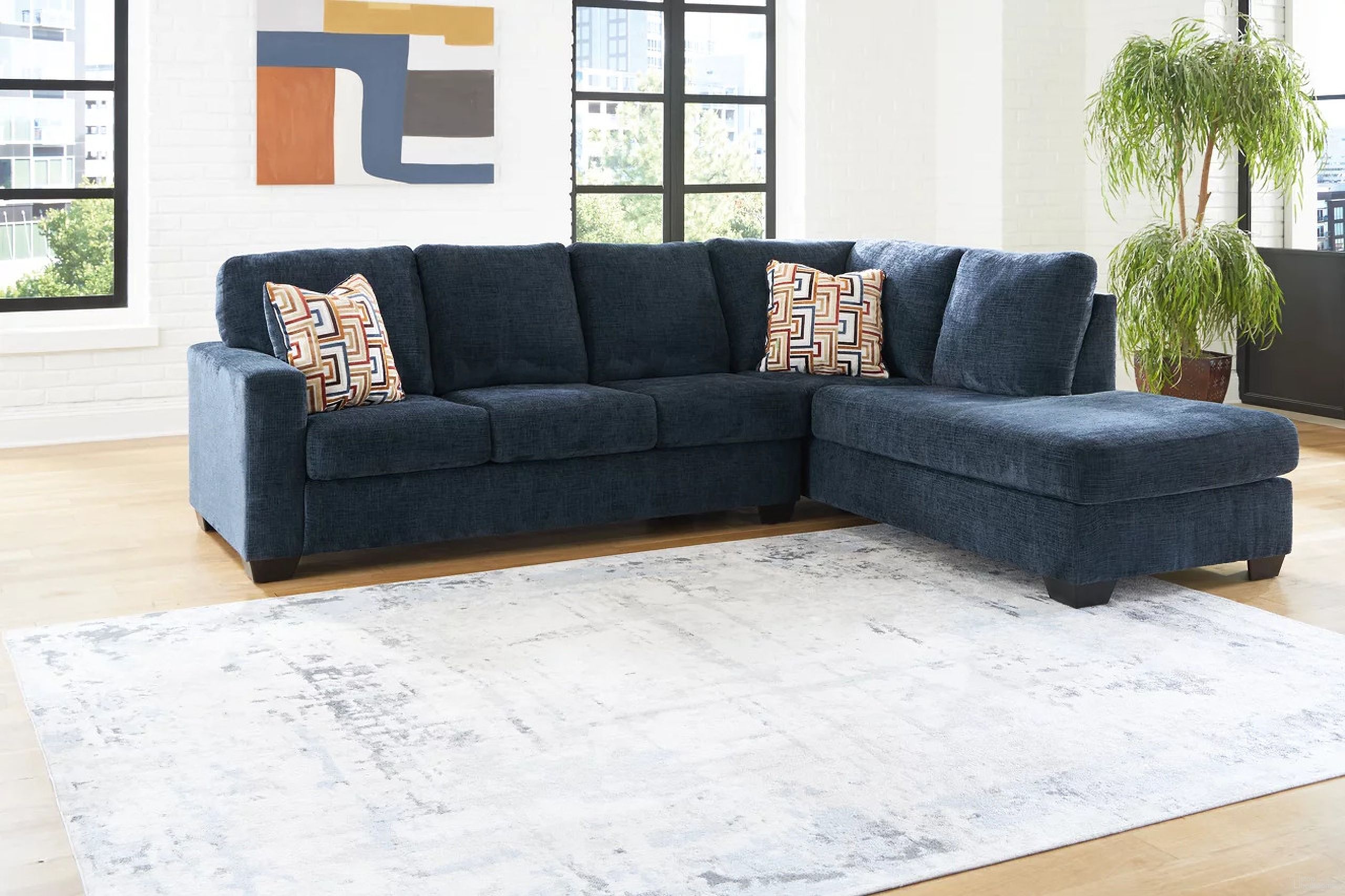 The appearance of Aviemore 2-Piece Sectional With RAF Chaise In Ink designed by Signature Design by Ashley in the transitional interior design. This ink piece of furniture was selected by 1StopBedrooms from Aviemore Collection to add a touch of cosiness and style into your home. Sku: 2430366;2430317. Material: Polyester. Layout: Sofa & Chaise. Orientation: RAF.