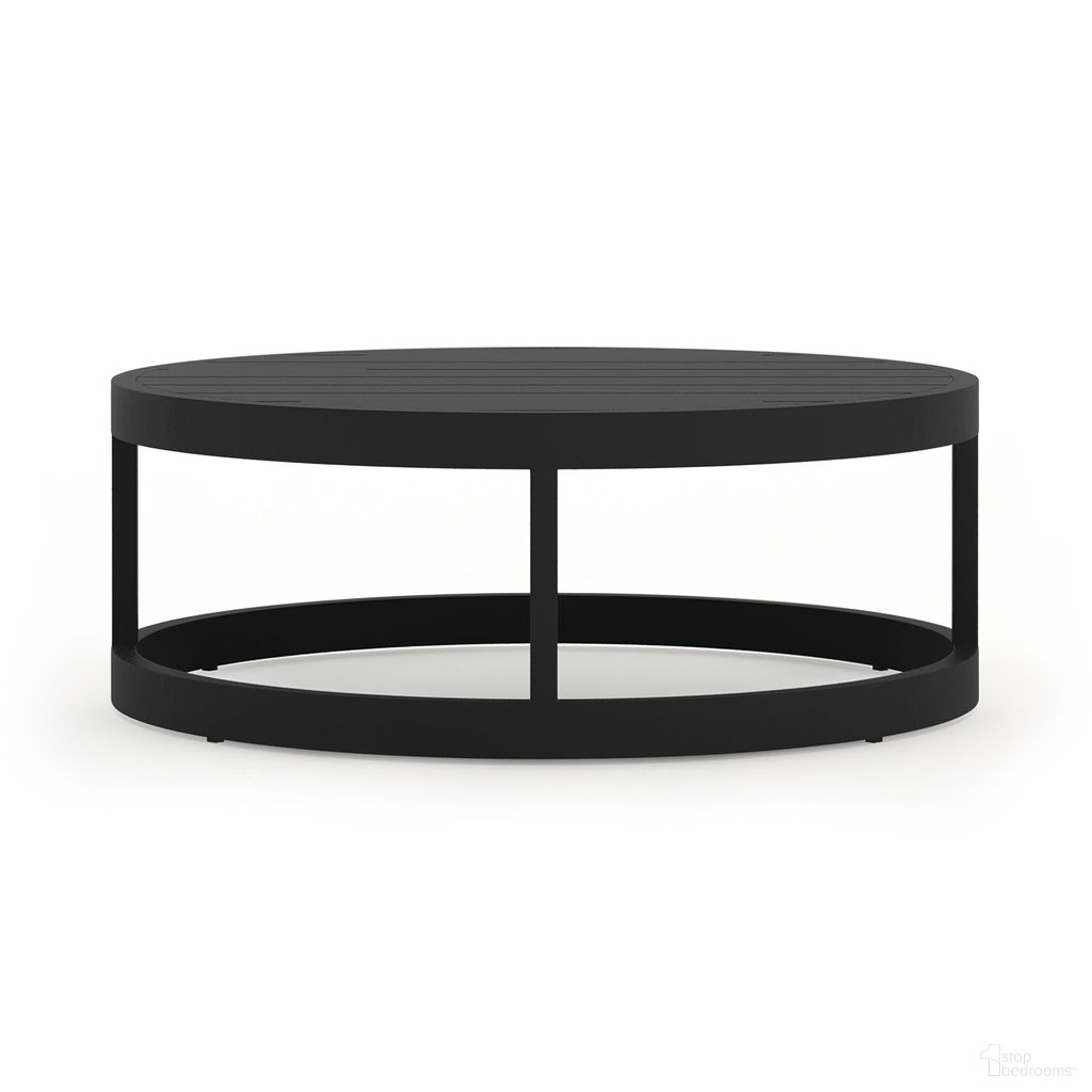 The appearance of Avion Round Coffee Table In Black designed by Harmonia Living in the transitional interior design. This black piece of furniture  was selected by 1StopBedrooms from Avion Collection to add a touch of cosiness and style into your home. Sku: HL-AVN-BK-RCT. Material: Aluminum.