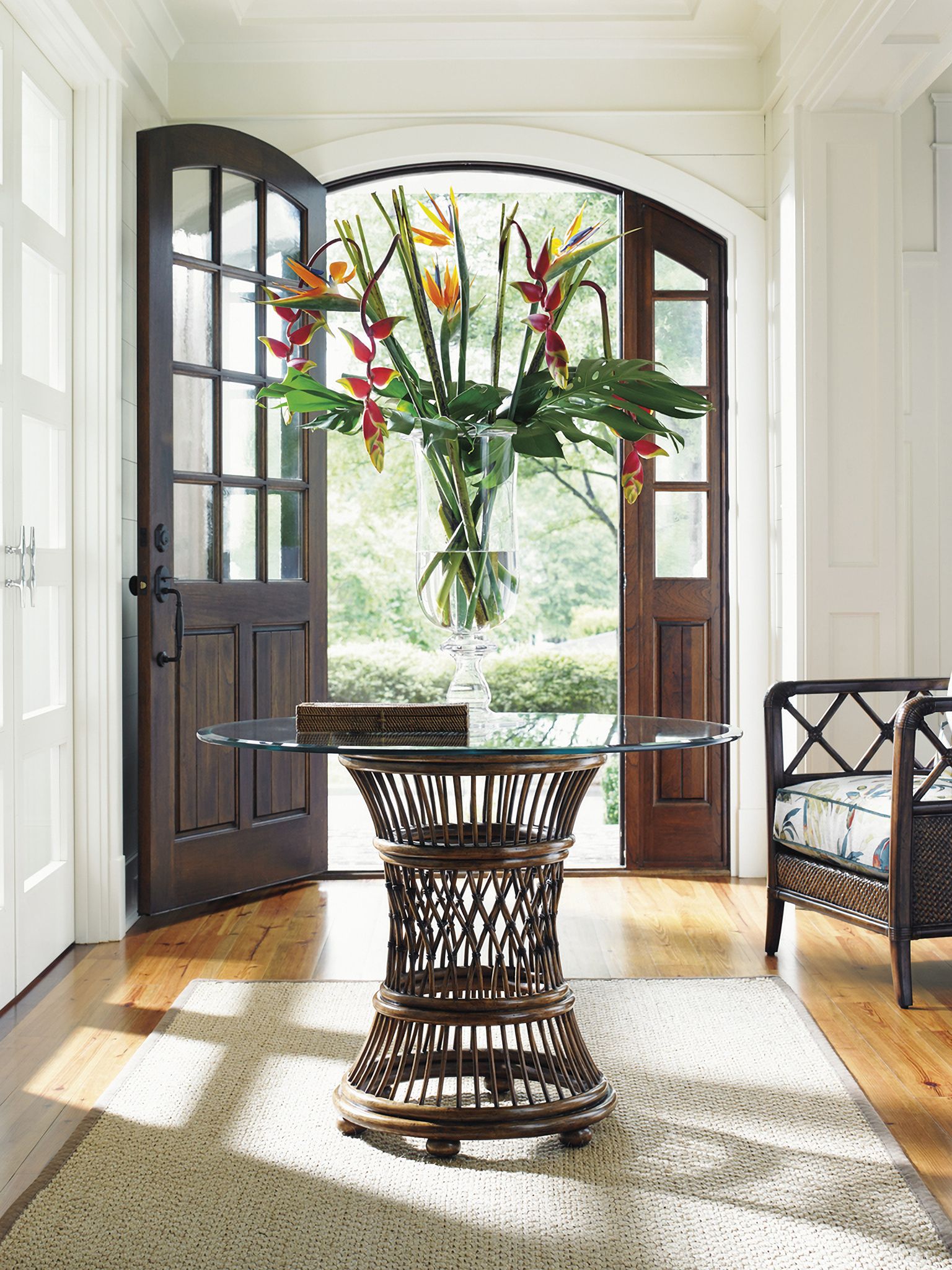 The appearance of Bali Hai Aruba Dining Table with 36 Inch Glass Top In Sunset designed by Tommy Bahama in the transitional interior design. This sunset piece of furniture was selected by 1StopBedrooms from Bali Hai Collection to add a touch of cosiness and style into your home. Sku: 593-870-36C. Table Base Style: Pedestal. Table Top Shape: Round. Material: Rattan. Size: 36".