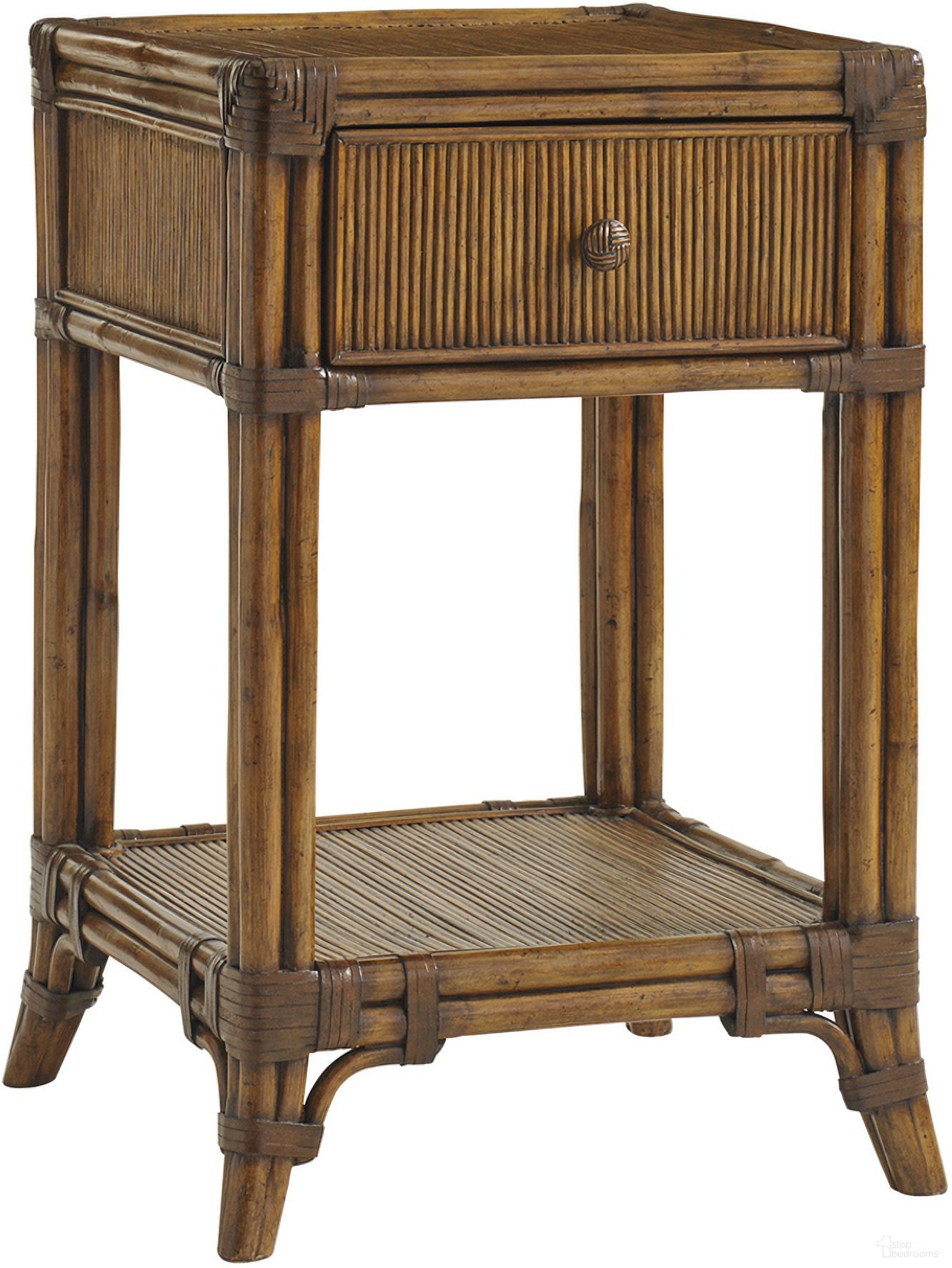The appearance of Bali Hai Del Sol Bedside Table In Sunset designed by Tommy Bahama in the transitional interior design. This sunset piece of furniture  was selected by 1StopBedrooms from Bali Hai Collection to add a touch of cosiness and style into your home. Sku: 593-622. Material: Rattan.