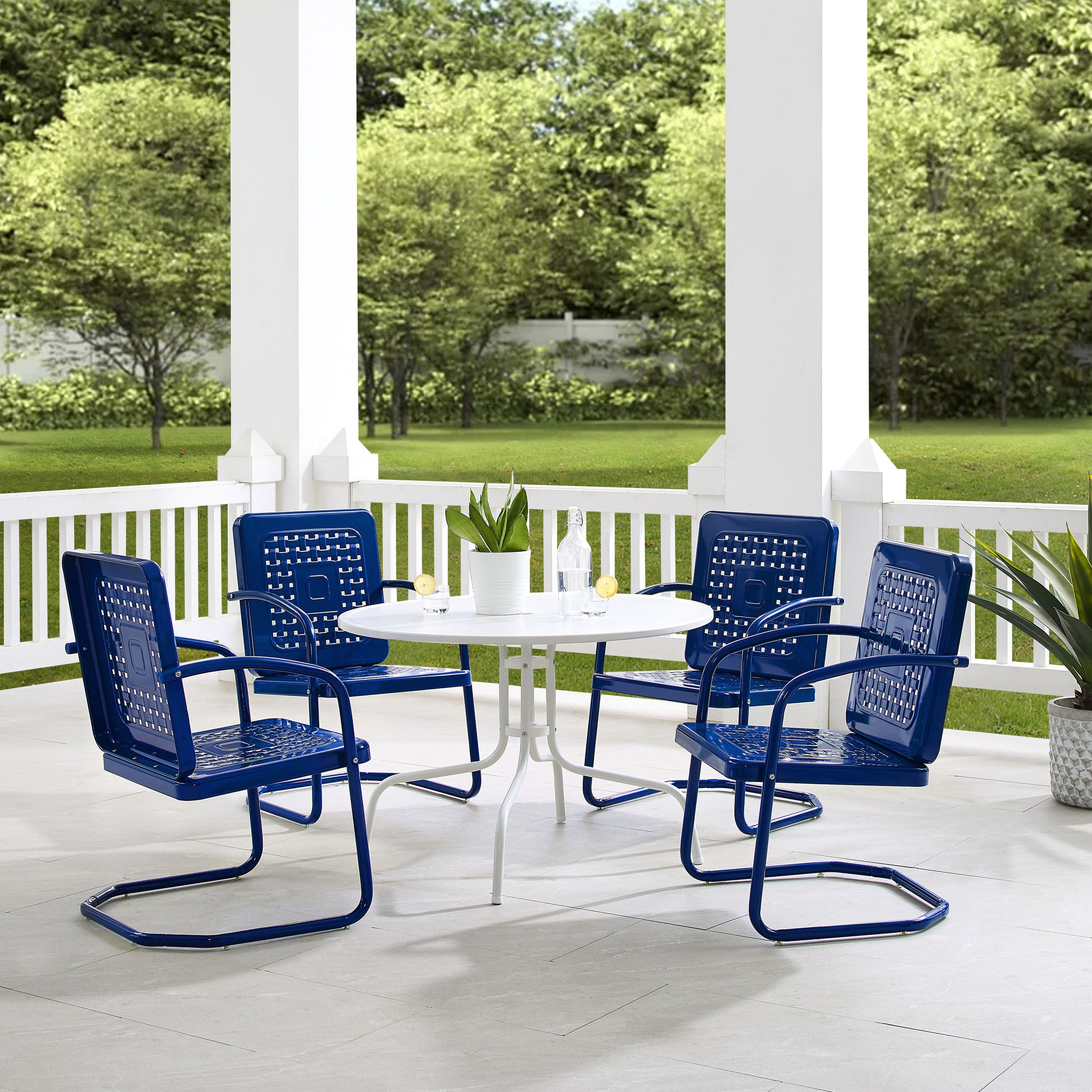 The appearance of Bates 5 Piece Round Retro Outdoor Dining Set In Navy Gloss and White Satin designed by Crosley Brands in the transitional interior design. This navy piece of furniture was selected by 1StopBedrooms from Bates Collection to add a touch of cosiness and style into your home. Sku: CO1012A-WH;CO1025-NV;CO1025-NV. Material: Steel.
