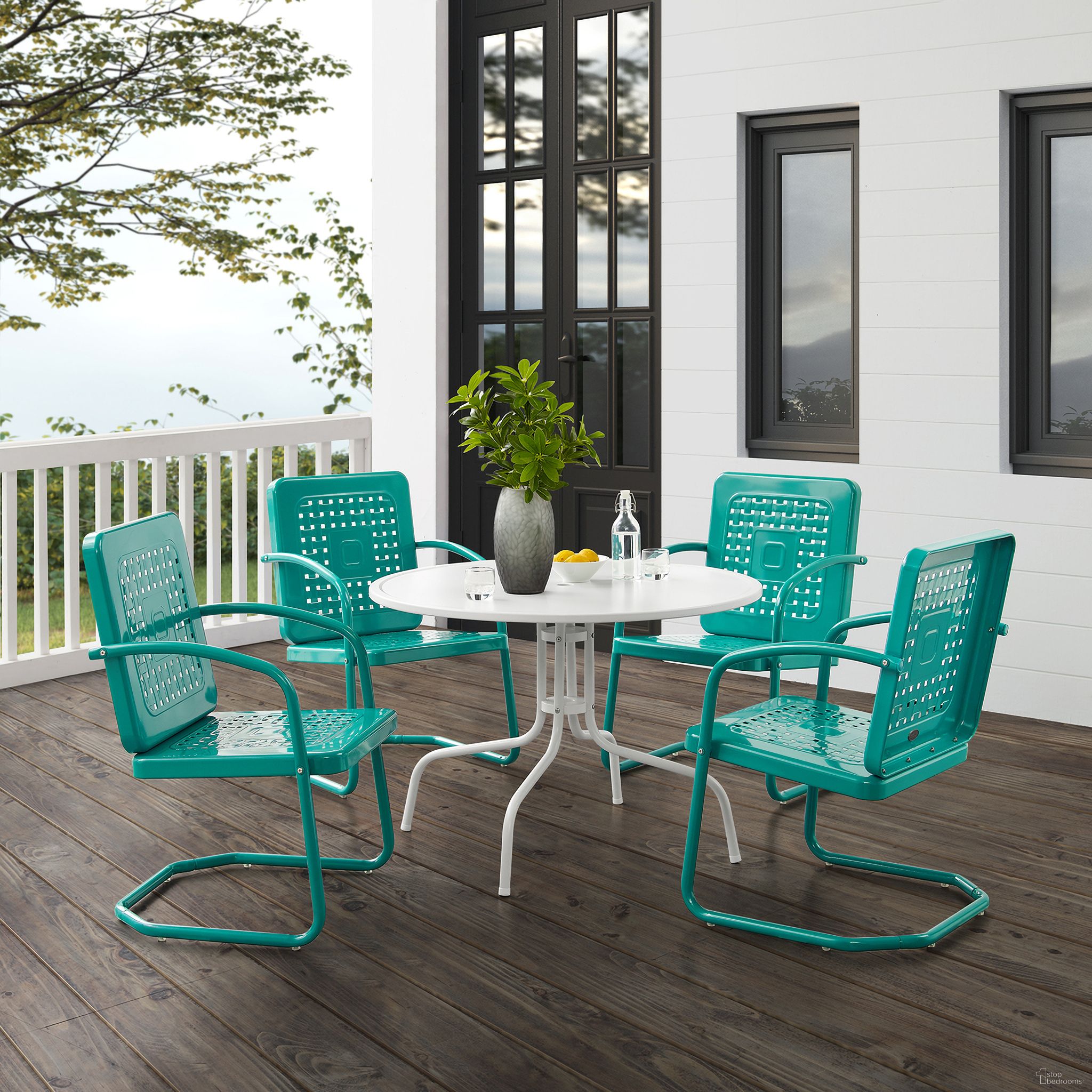 The appearance of Bates 5 Piece Round Retro Outdoor Dining Set In Turquoise Gloss and White Satin designed by Crosley Brands in the transitional interior design. This turquoise piece of furniture was selected by 1StopBedrooms from Bates Collection to add a touch of cosiness and style into your home. Sku: CO1012A-WH;CO1025-TU;CO1025-TU. Material: Steel.